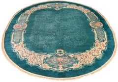 Antique Oval Chinese Rug in Turquoise with Coral and Violet Flower Blossoms