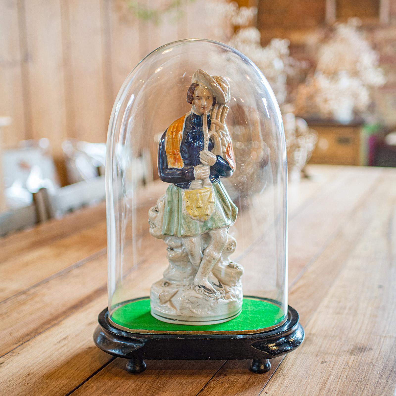 
This is an antique oval collector's dome. An English, glass and ebonised mahogany clock case or botany showcase, dating to the Victorian period, circa 1900.

Charming oval form, offering versatility for multiple purposes
Displays a desirable aged