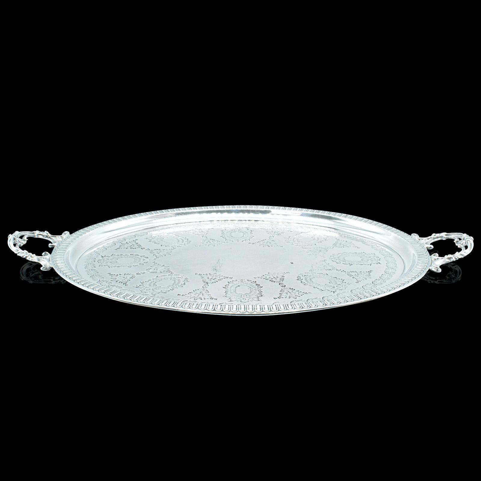This is an antique oval decorative serving tray. An English, silver plate afternoon tea plater by Walker & Hall, dating to the Edwardian period, circa 1910.

Beaming with a reflective shine, a superb addition to the tea service
Displays a