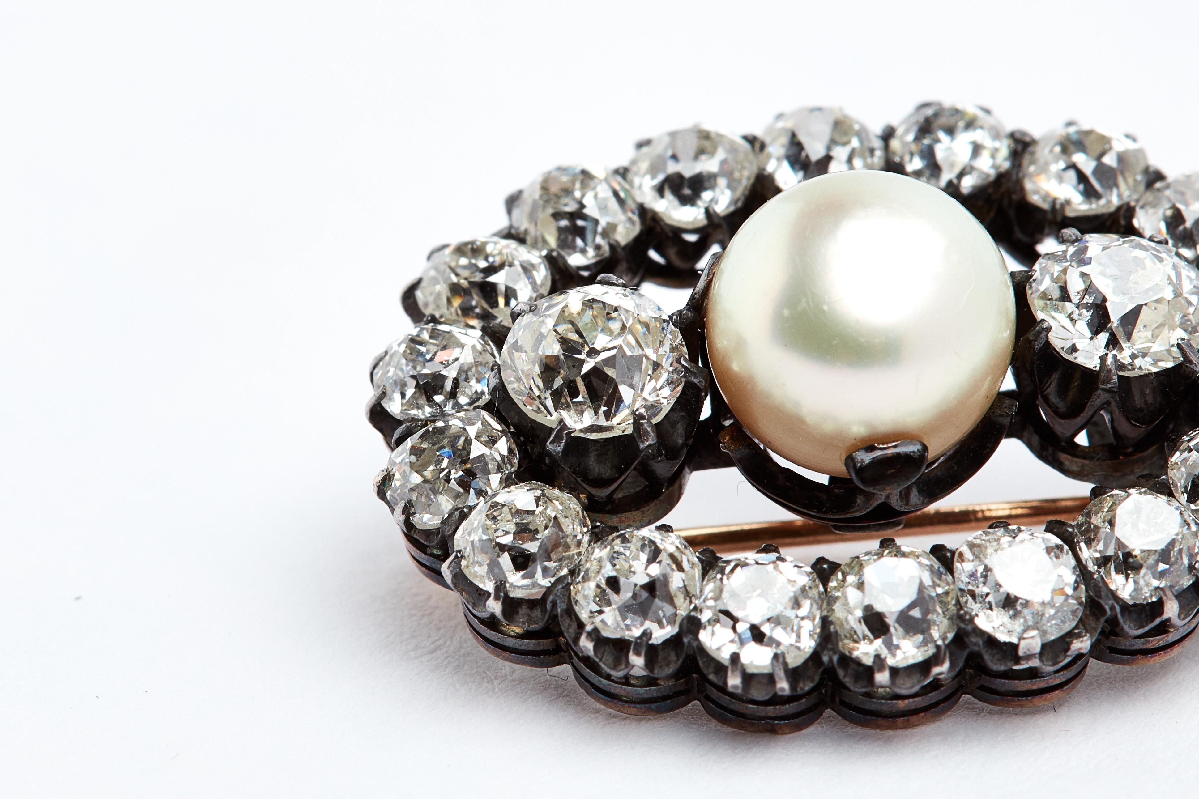 18k Antique Oval Diamond and Pearl Brooch. 22 old european cut white round diamonds. aprox 6 carats total. 