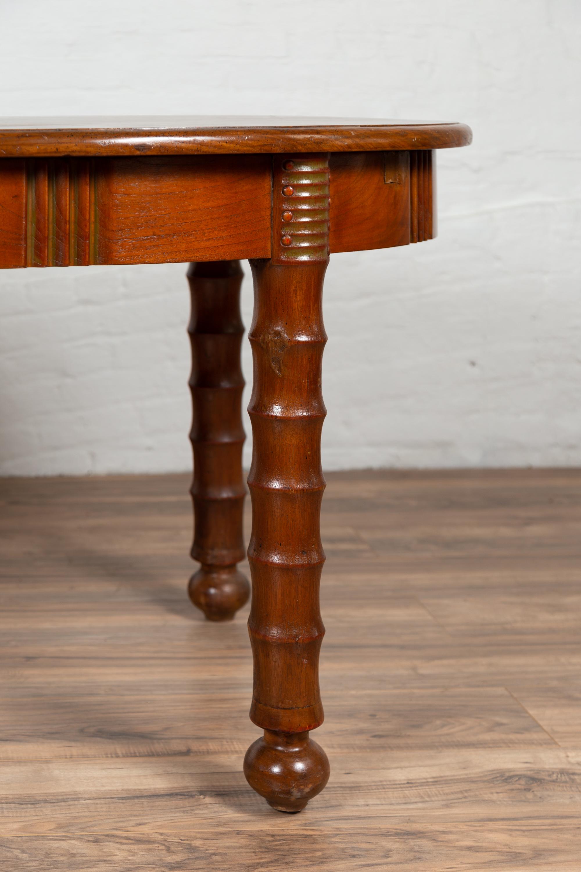 Wood Antique Oval Dining Room Table from Indonesia with Spindle Legs and Warm Patina For Sale