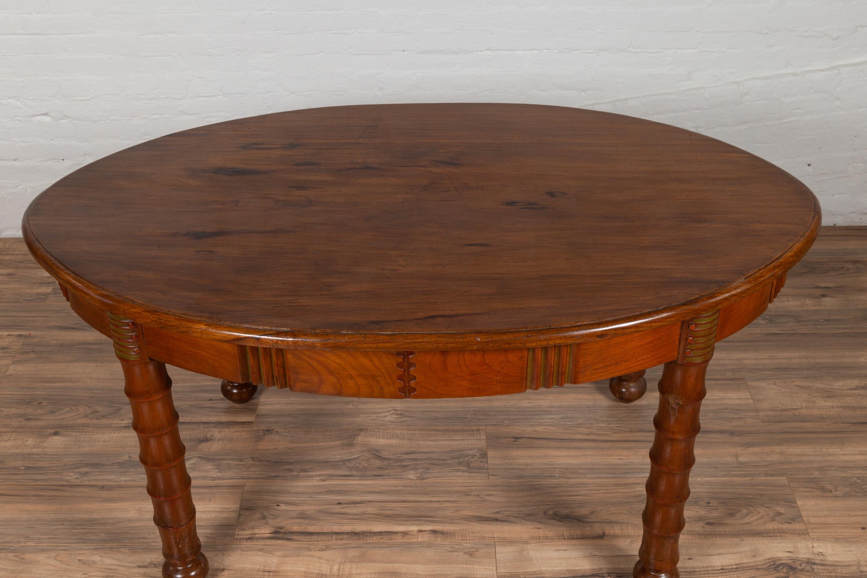 Antique Oval Dining Room Table from Indonesia with Spindle Legs and Warm Patina For Sale 1