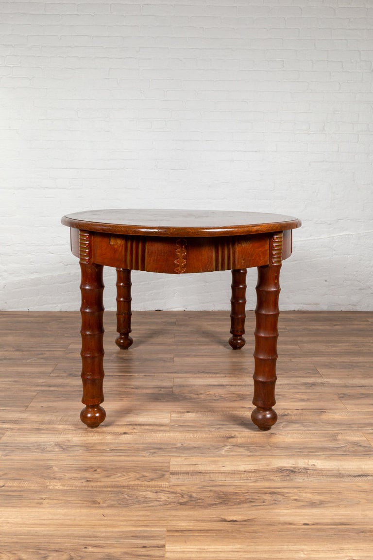 Antique Oval Dining Room Table from Indonesia with Spindle Legs and Warm Patina For Sale at 1stdibs