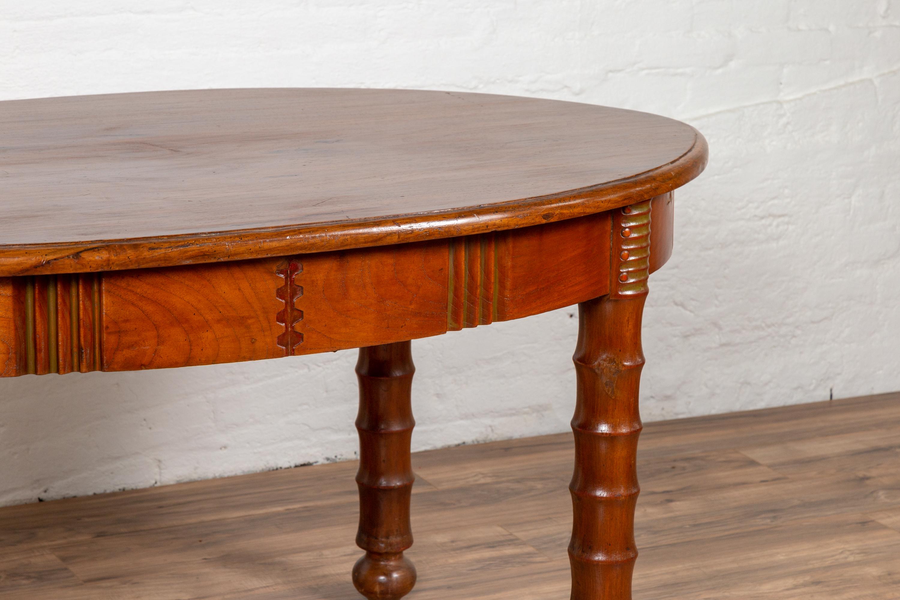 Indonesian Antique Oval Dining Room Table from Indonesia with Spindle Legs and Warm Patina For Sale