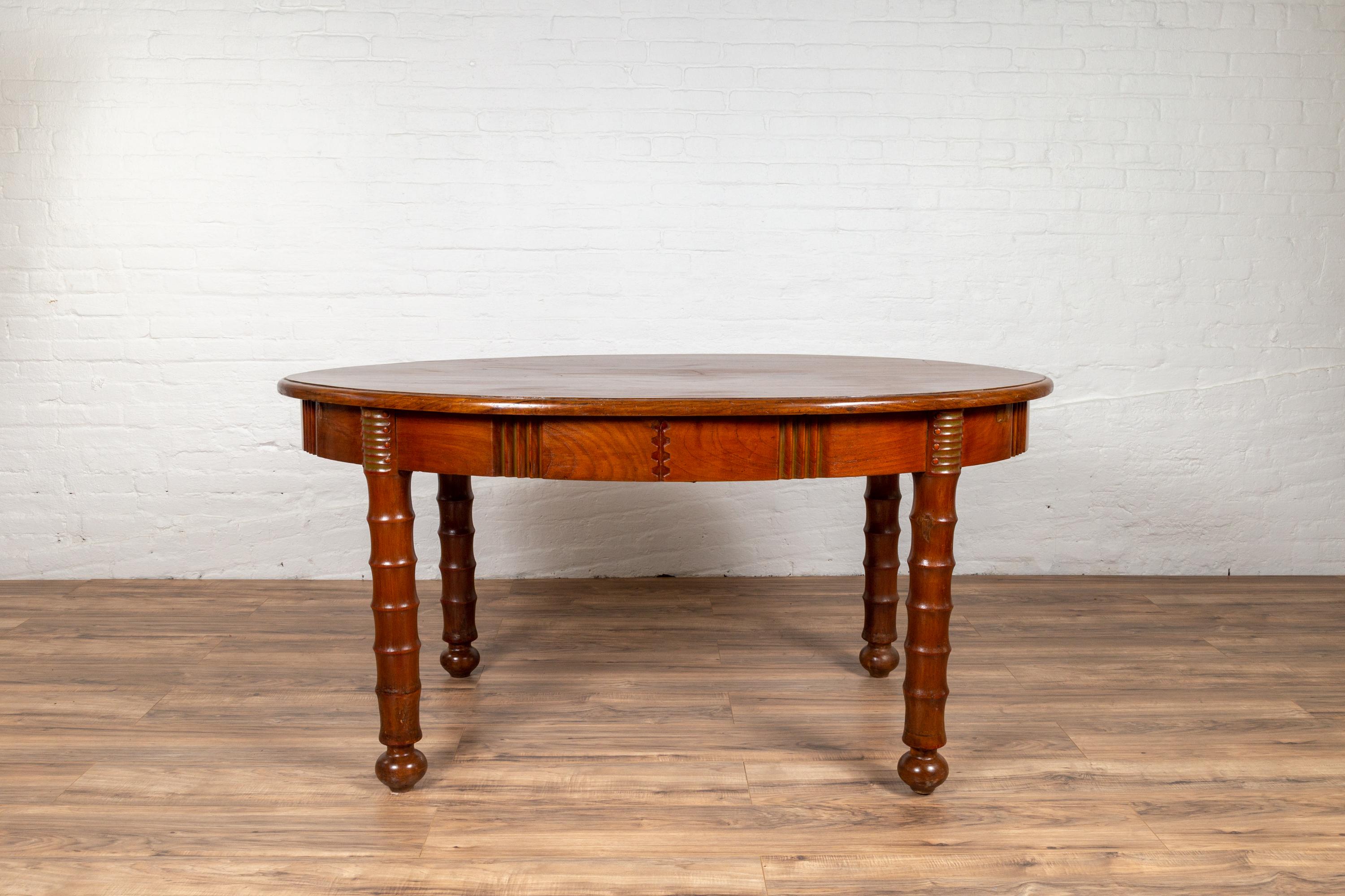 Antique Oval Dining Room Table from Indonesia with Spindle Legs and Warm Patina In Good Condition For Sale In Yonkers, NY