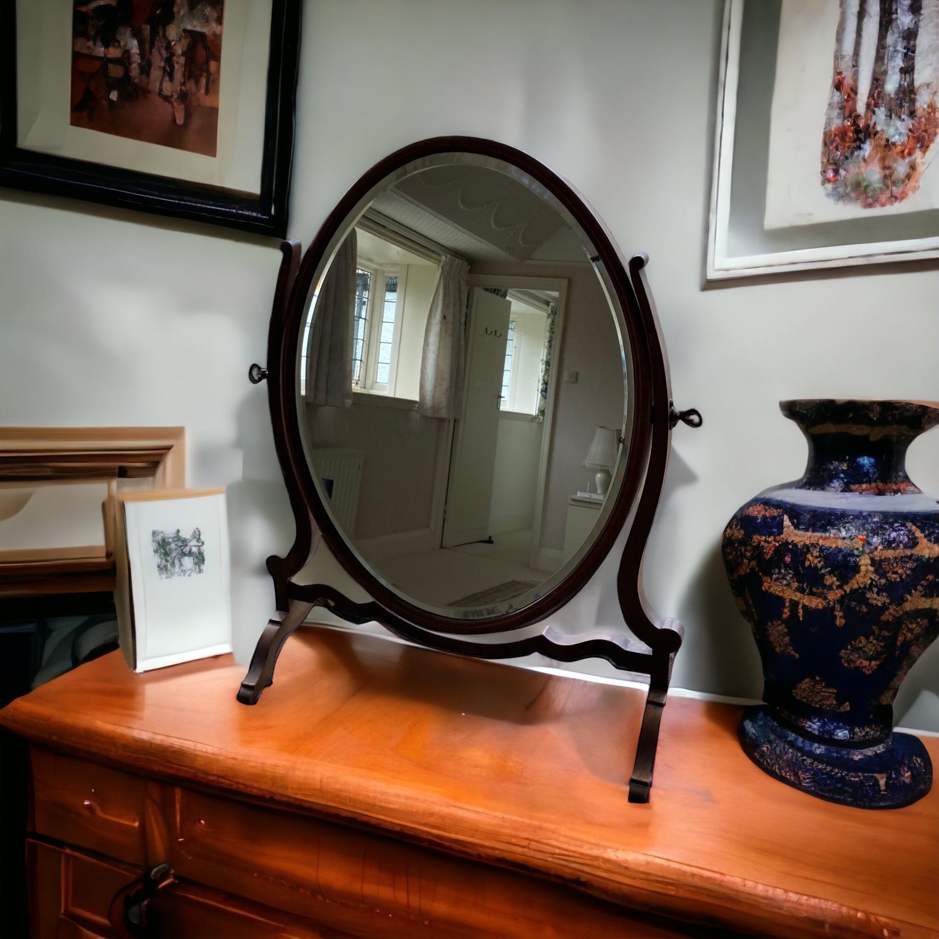 Antique Oval Dressing Mirror late 19th Century Victorian, mahogany fram and stand with slight foxing to the glass adding to its' character and look. 

H: 56 cm

W: 37 cm

D: 23 cm (base)