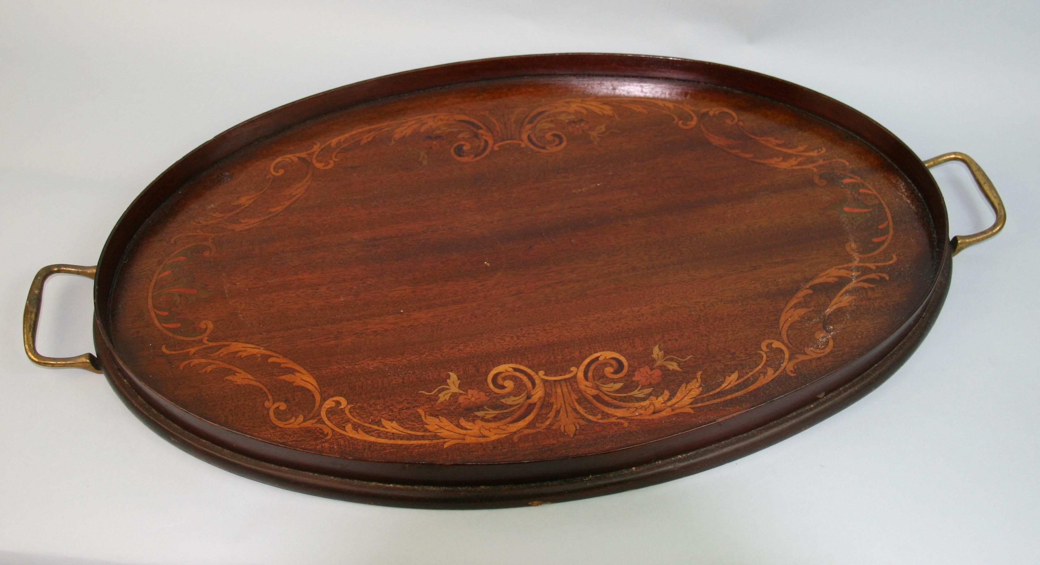 3-1138 Antique Edwardian  English  oval serving tray with brass handles.
Saddle wood marquetry.