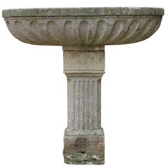 Antique Oval Limestone Trough with Fluted Sides Standing on a Pedestal Antique Oval Limestone Trough with Fluted Sides Standing on a Pedestal