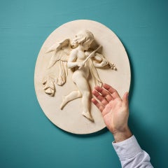 Antique Oval Plaster Relief Plaque of a Musical Putto