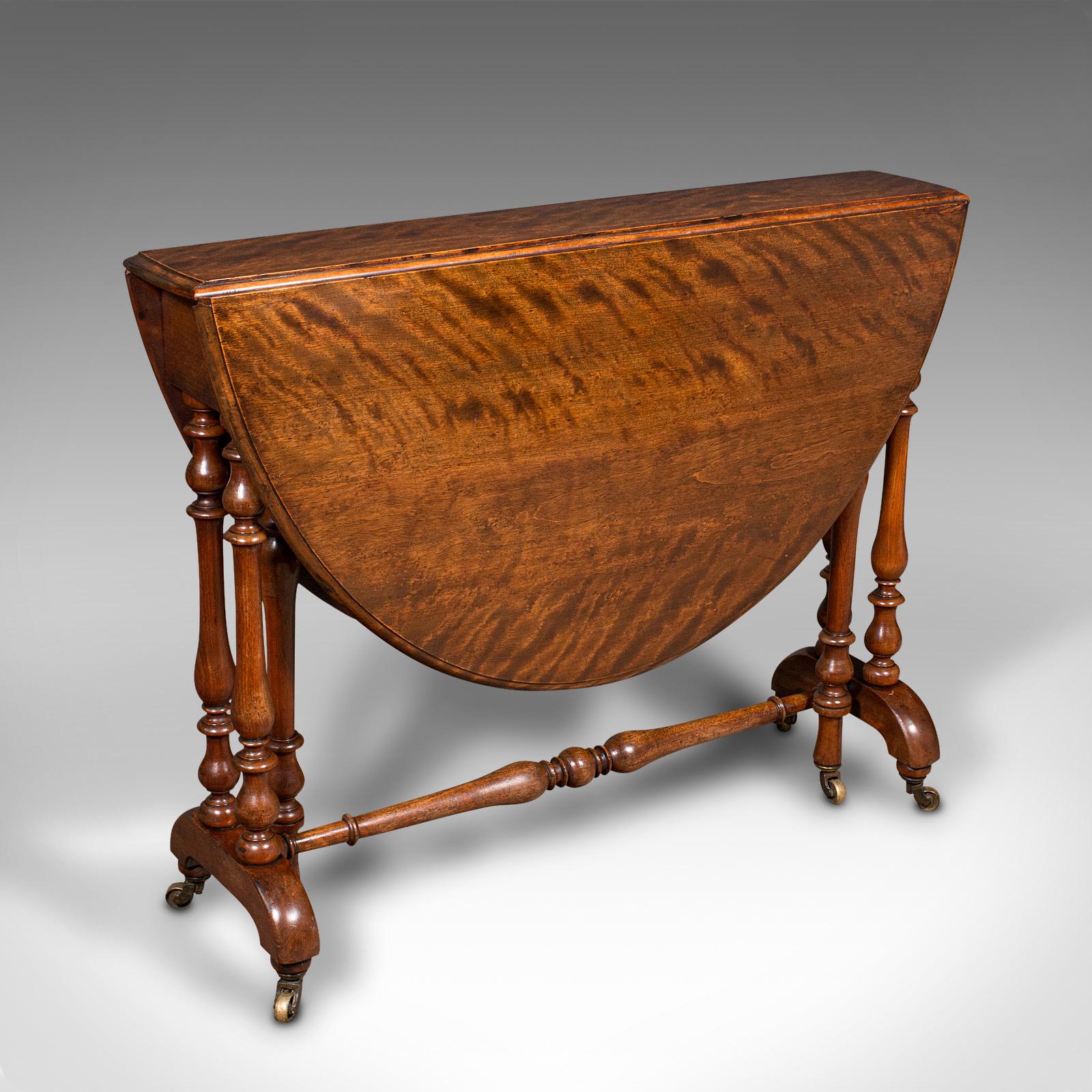This is an antique oval Sutherland table. An English, satin mahogany gate-leg occasional table, dating to the early Victorian period, circa 1850.

Graced with exquisite figuring and deep colour
Displays a desirable aged patina and in very good