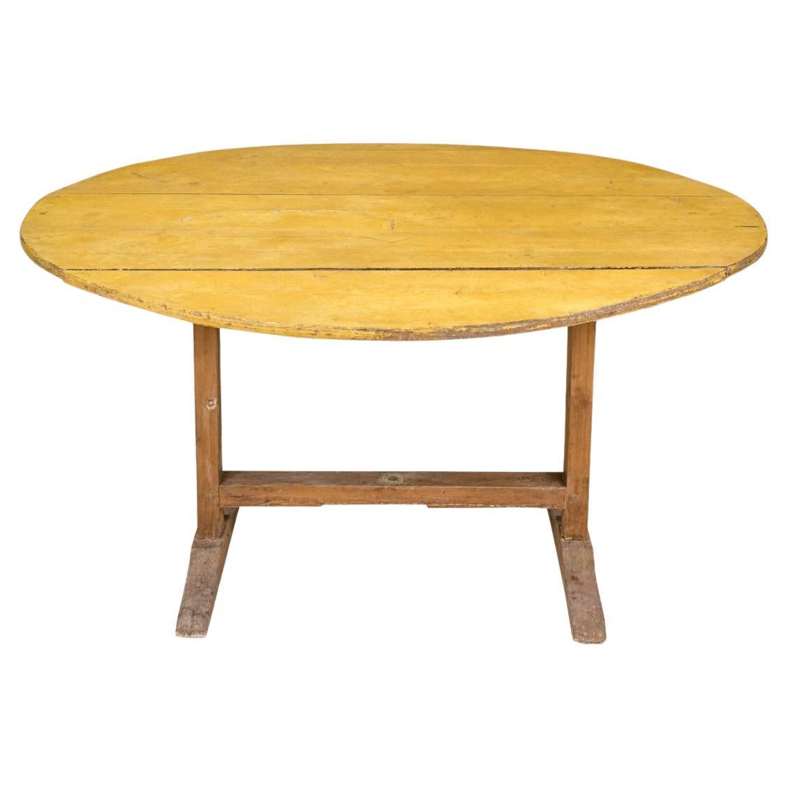 Antique Oval Tilt Top Trestle Table In Mustard Paint