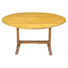 Used Oval Tilt Top Trestle Table In Mustard Paint