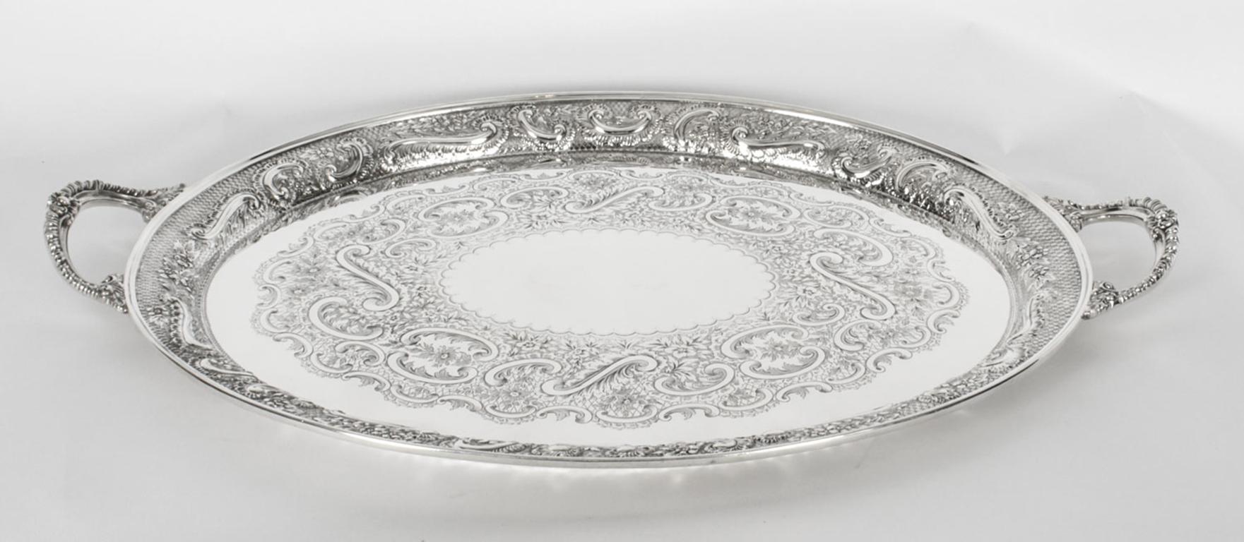 This is a magnificent antique English Victorian oval silver-plated twin handled tray by the renowned Silversmith Mappin & Webb, circa 1880 in date.
 
This splendid tray features beautifully engraved and embossed foliate and floral decoration with