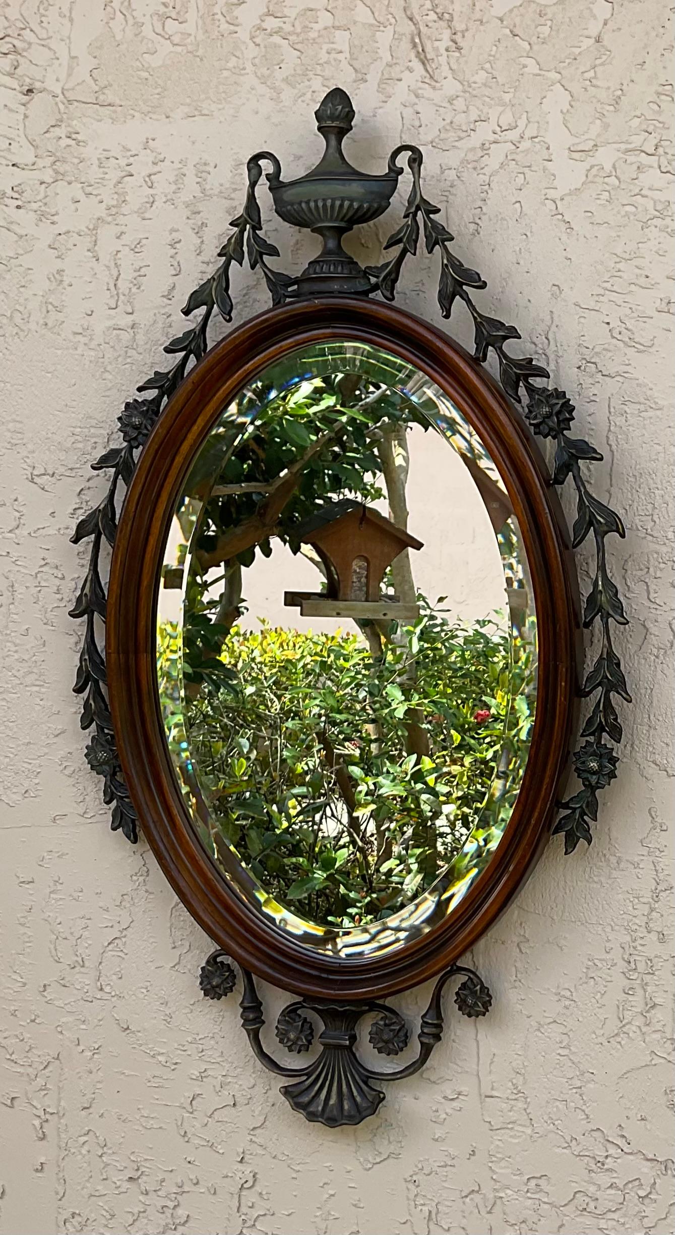 Elegant wall hanging hand carved wood mirror ,with bronze floral and vine decoration around , thick beveled mirror . 
Great addition to any wall in the house 
Actual glass size “10”.5 x 15”.5 