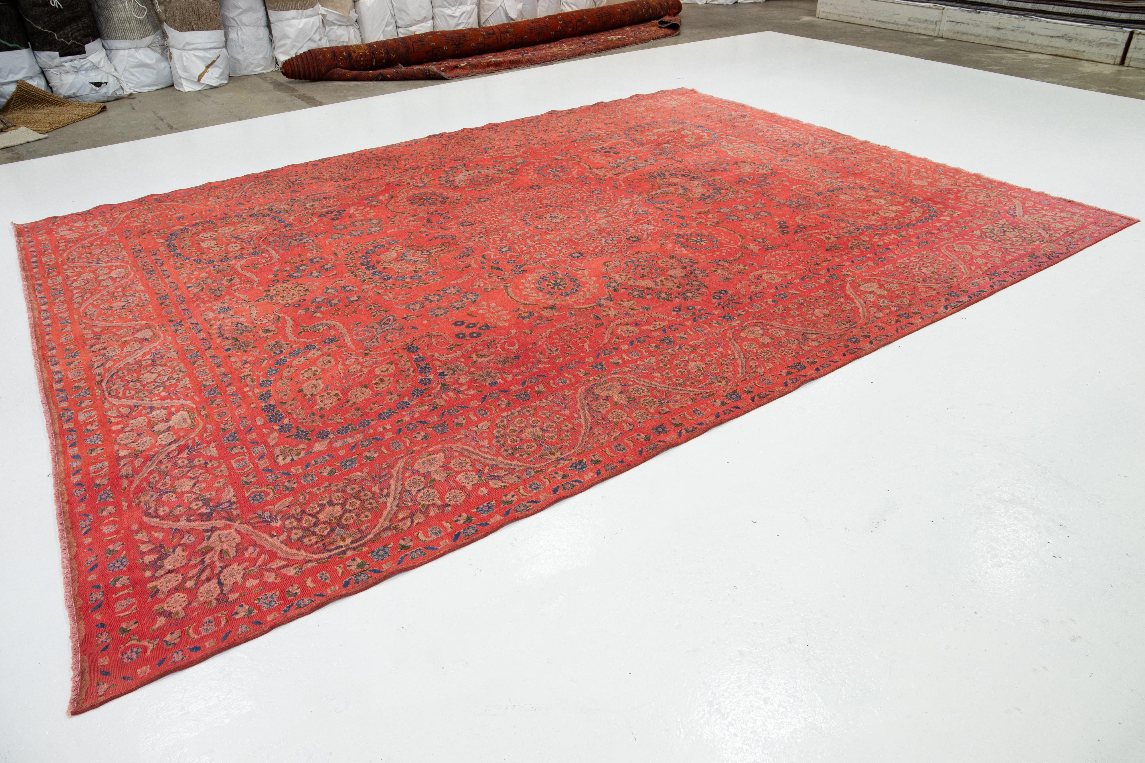 Hand-Knotted Antique  Overdyed Red Wool Rug With Rosette Design For Sale