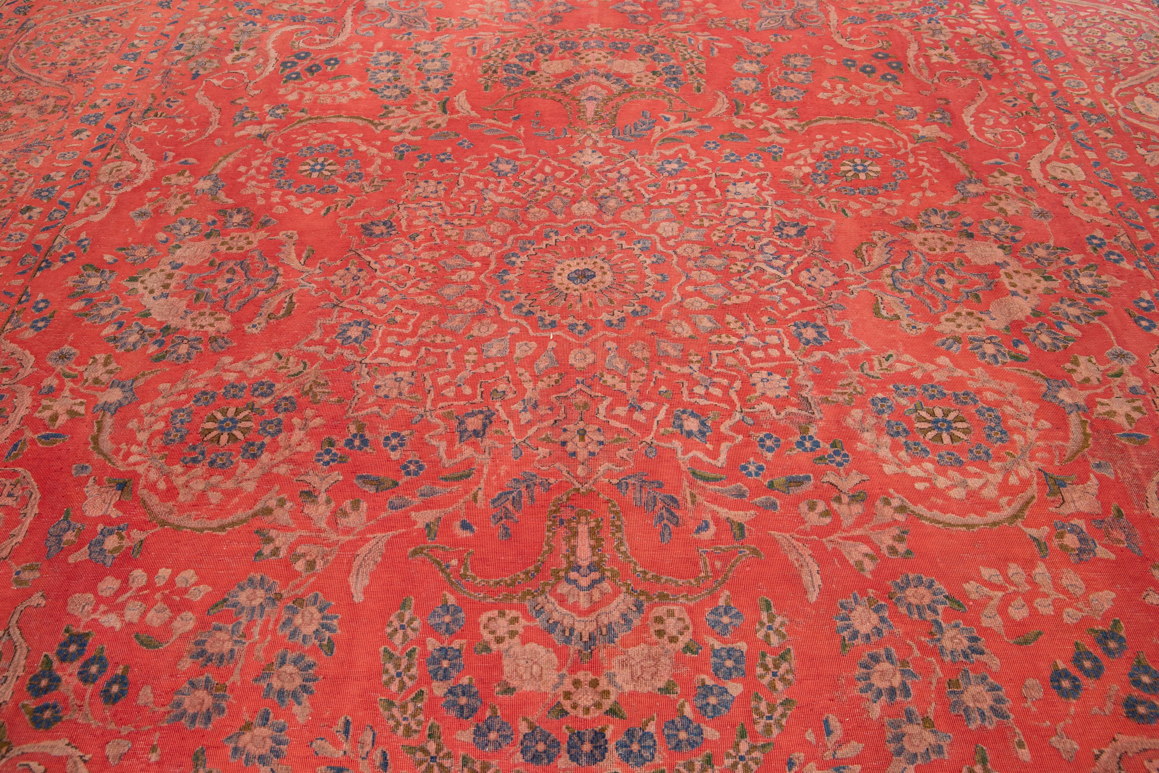 20th Century Antique  Overdyed Red Wool Rug With Rosette Design For Sale