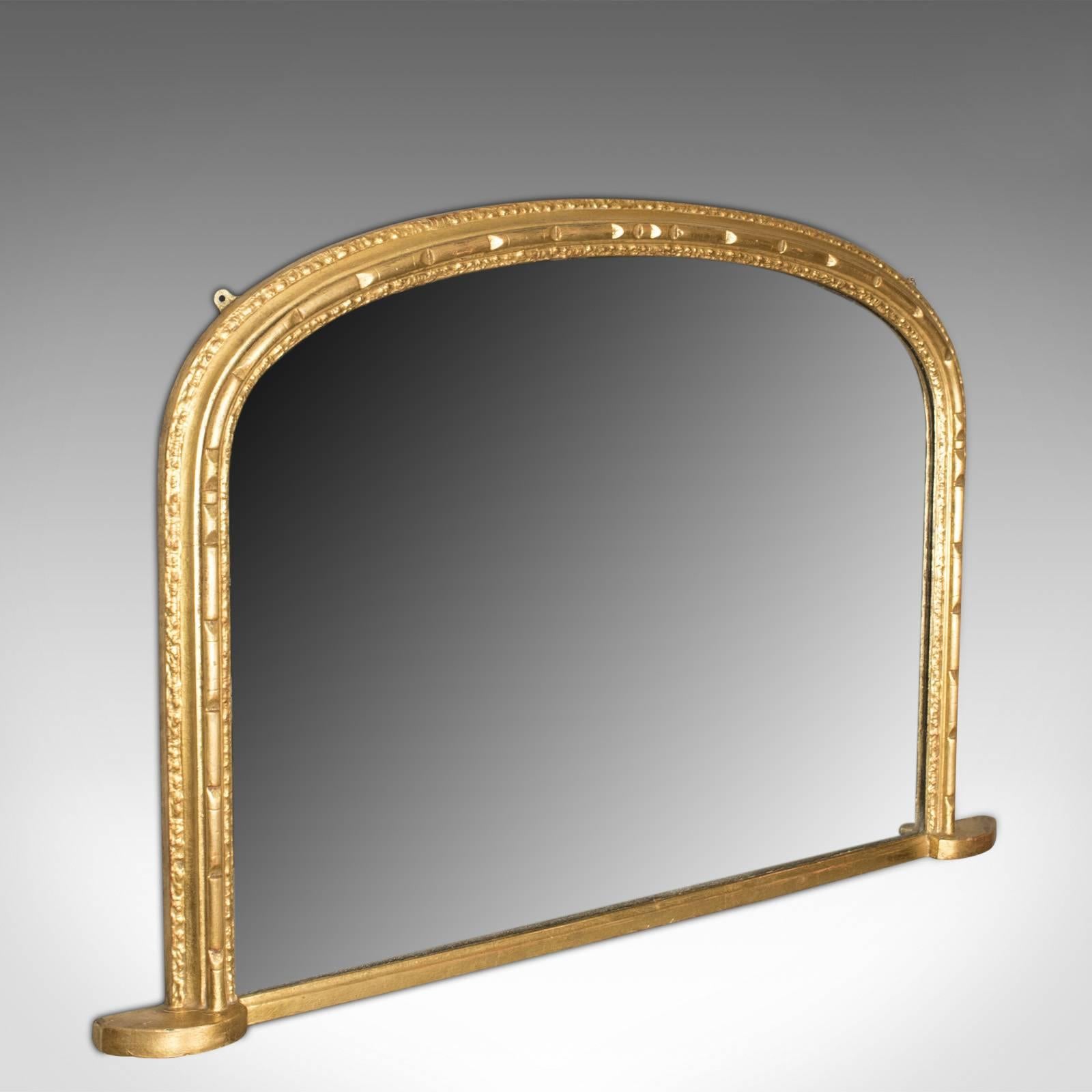 This is an antique overmantel mirror, an English, Georgian, dome topped wall mirror in giltwood and gesso dating to circa 1800.

Of classic Georgian, dome topped design
Mid-sized and of good proportion
The frame moulding a modest trace of beads