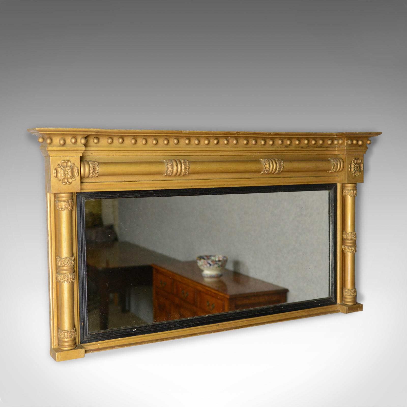 This is an antique overmantel mirror. An English, Georgian, giltwood and gesso wall mirror dating to circa 1800.

Attractive, mellow golden tones in the giltwood and gesso frame
A quality mirror from the late Georgian period
Mid-sized and in