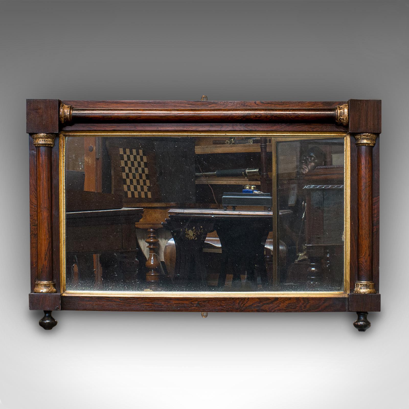 This is an antique overmantel mirror. An English, Rosewood and glass rectangular mirror, dating to the Regency period, circa 1820.

Generously sized and pleasingly foxed
Displaying a desirable aged patina
Rosewood shows fine grain interest and