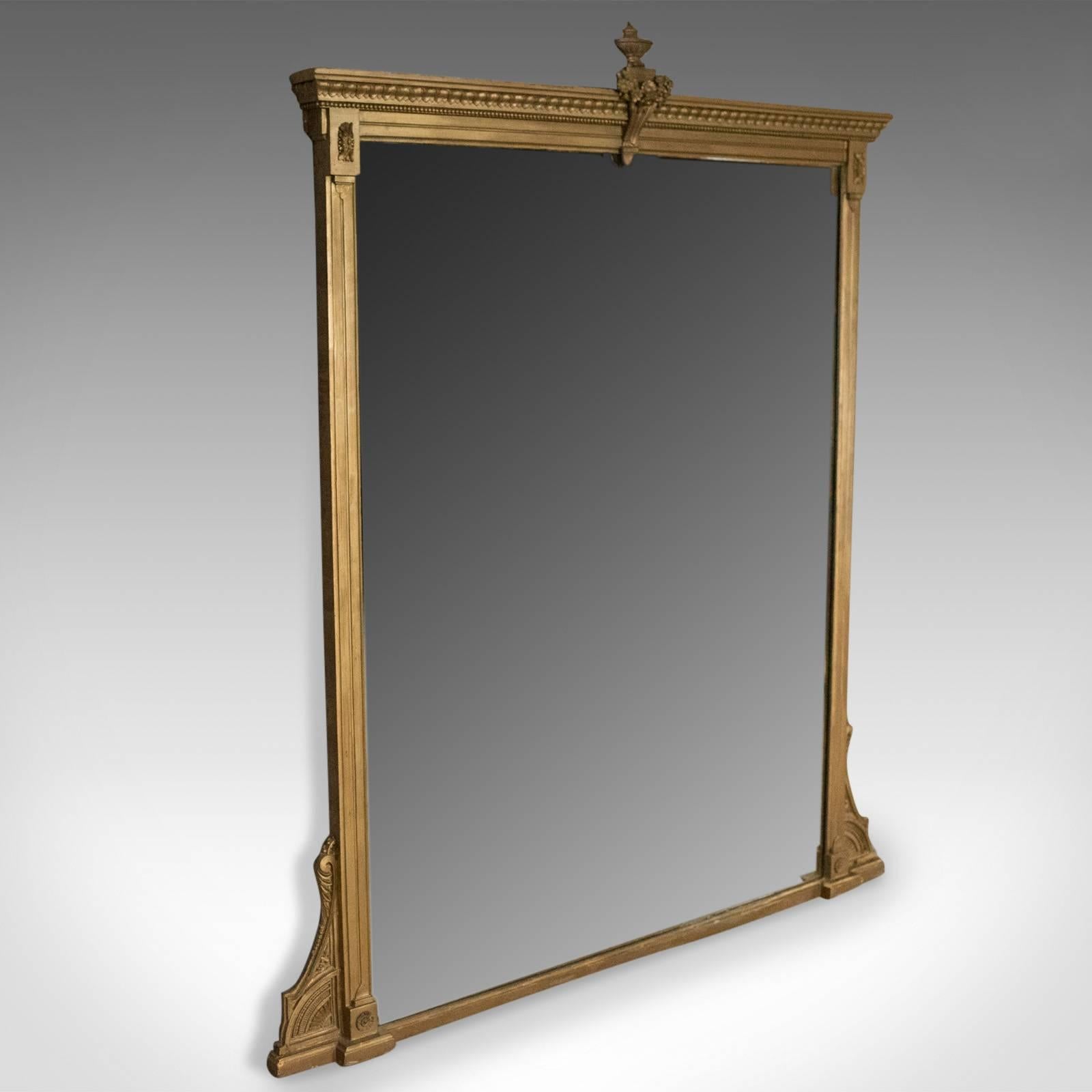 This is an antique overmantel mirror. A Victorian classical revival wall mirror from the 19th century, circa 1880.

In good proportion with a quality giltwood finish
Displaying modest classical revival styling
Later mirror plate in very good