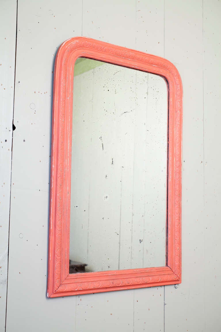 Louis Phillipe mirror circa 1860s with original glass

Over-painted with striking persimmon color

Original glass with some streaking (bottom left-hand corner is a reflection of a bench not damage).

 
