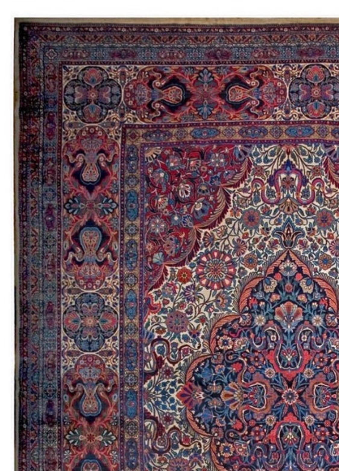 This is an exquisite antique oversize Persian Floral Kirman Lavar rug, circa 1910-1920s, measuring 19.3 x 30 ft in pristine condition. 

Provenance:
Sotheby's Auction House, New York, NY in fall 2001

The carpets produced in Lavar are often
