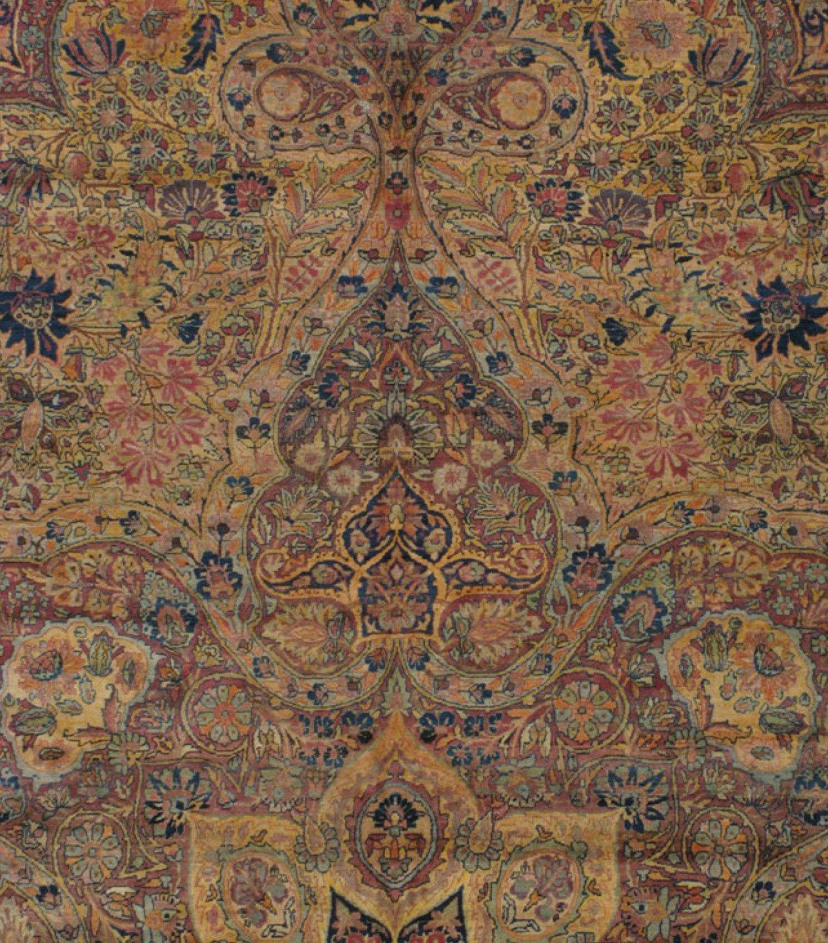 This is an exquisite antique oversize Persian gold floral Kirman Lavar rug circa 1880s-1900s measuring 17 x 23 ft in pristine condition.

The carpets produced in Lavar are often included in the general category of Kerman rugs (as Lavar is a small