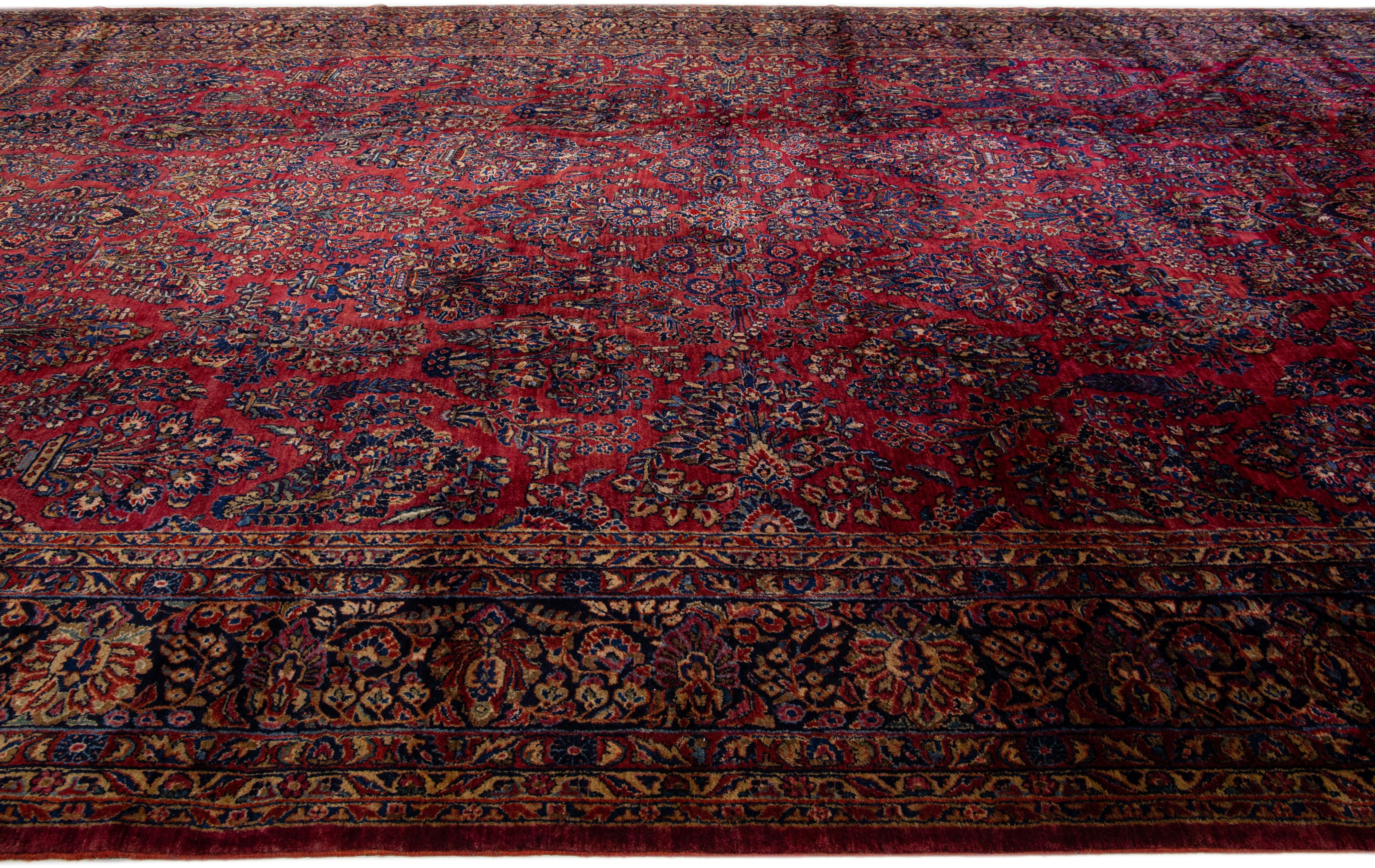 Hand-Knotted Antique Oversize Persian Sarouk Wool Rug with Classic Floral Design in Red For Sale