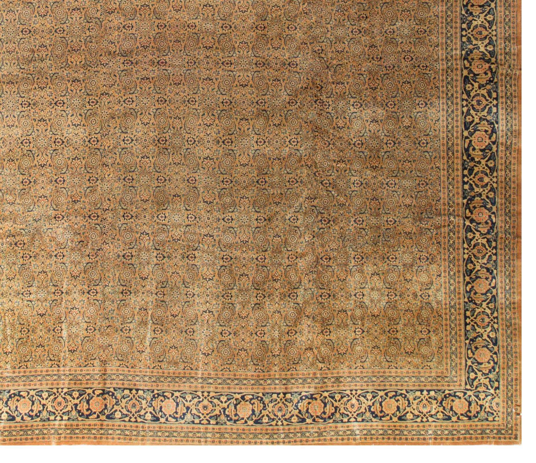 Oversize Persian Tabriz Rug Carpet, circa 1930. The Persian carpet revival began in Tabriz, circa 1870 and Tabriz carpet merchants were instrumental in the Renaissance of the craft throughout Iran. Because Tabriz has always been an important Persian