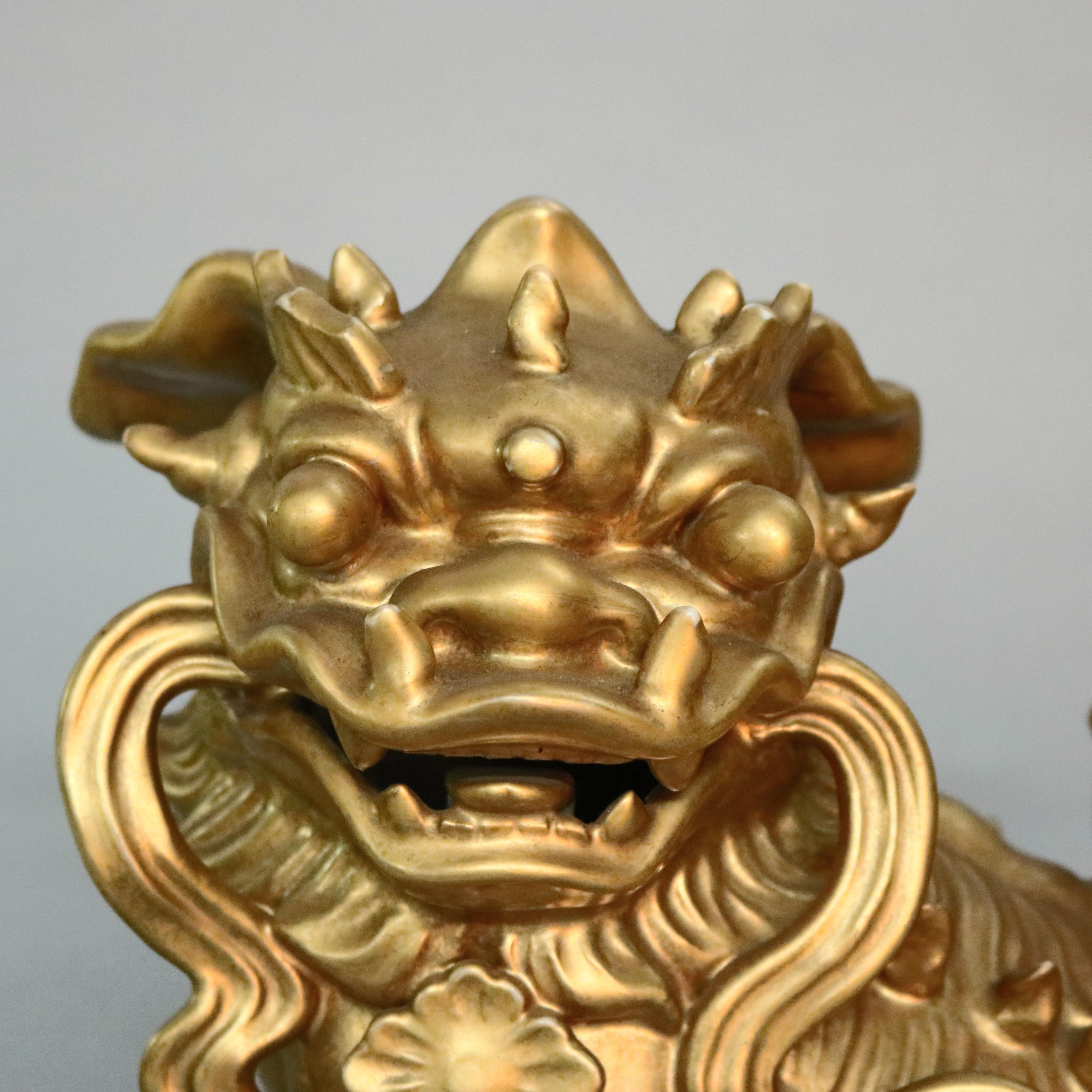 An antique oversized figural Chinese Qing dynasty foo dog with ball offers porcelain construction with all-over gilt finish, 19th century.

***DELIVERY NOTICE – Due to COVID-19 we have employed LIMITED-TO-NO-CONTACT PRACTICES in the transfer of