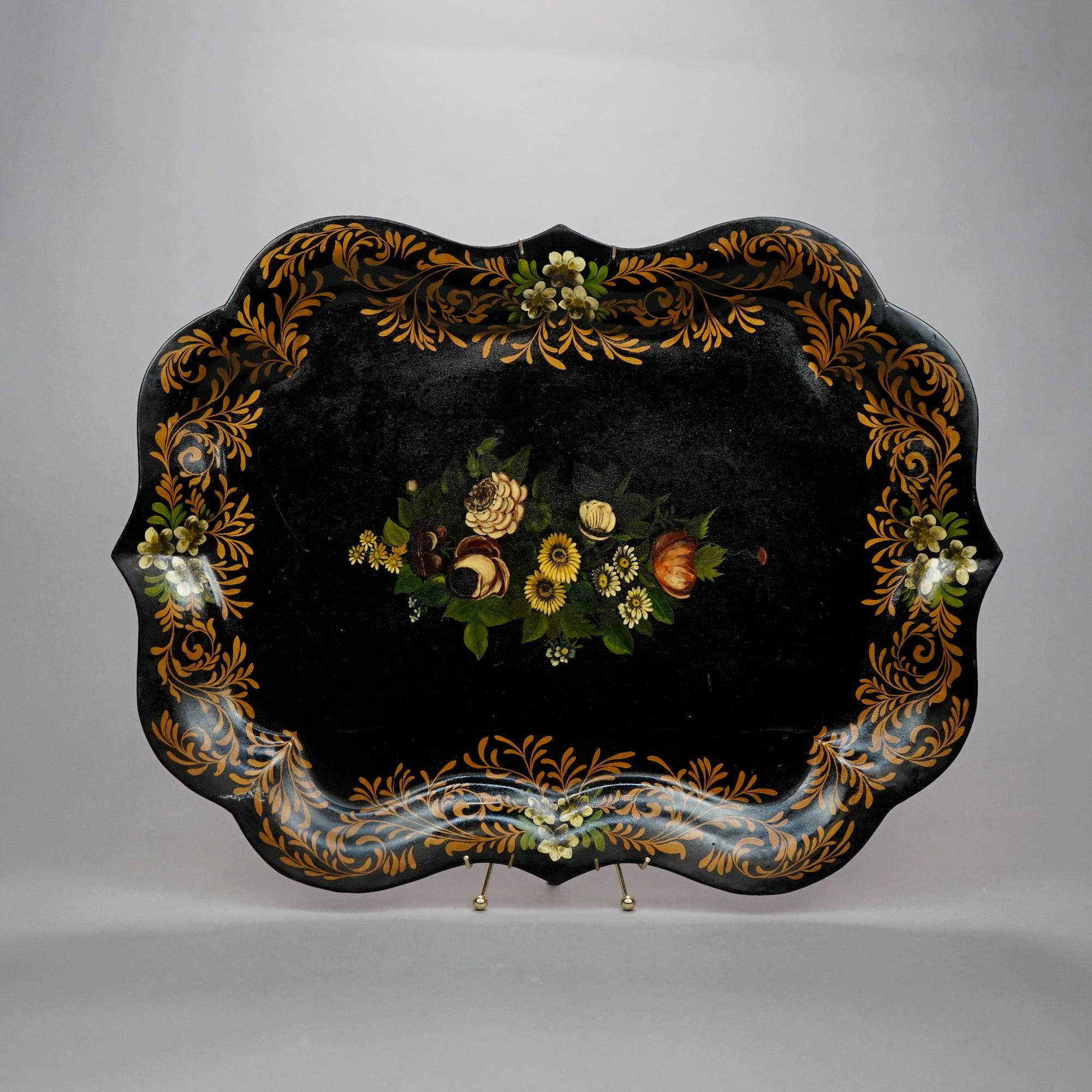 An antique and large toleware serving tray offers shaped metal construction with hand painted floral and foliate decoration, 19th century.

Measures- 1.25''H x 29.5''W x 22.5''D.

Catalogue Note: Ask about DISCOUNTED DELIVERY RATES available to most