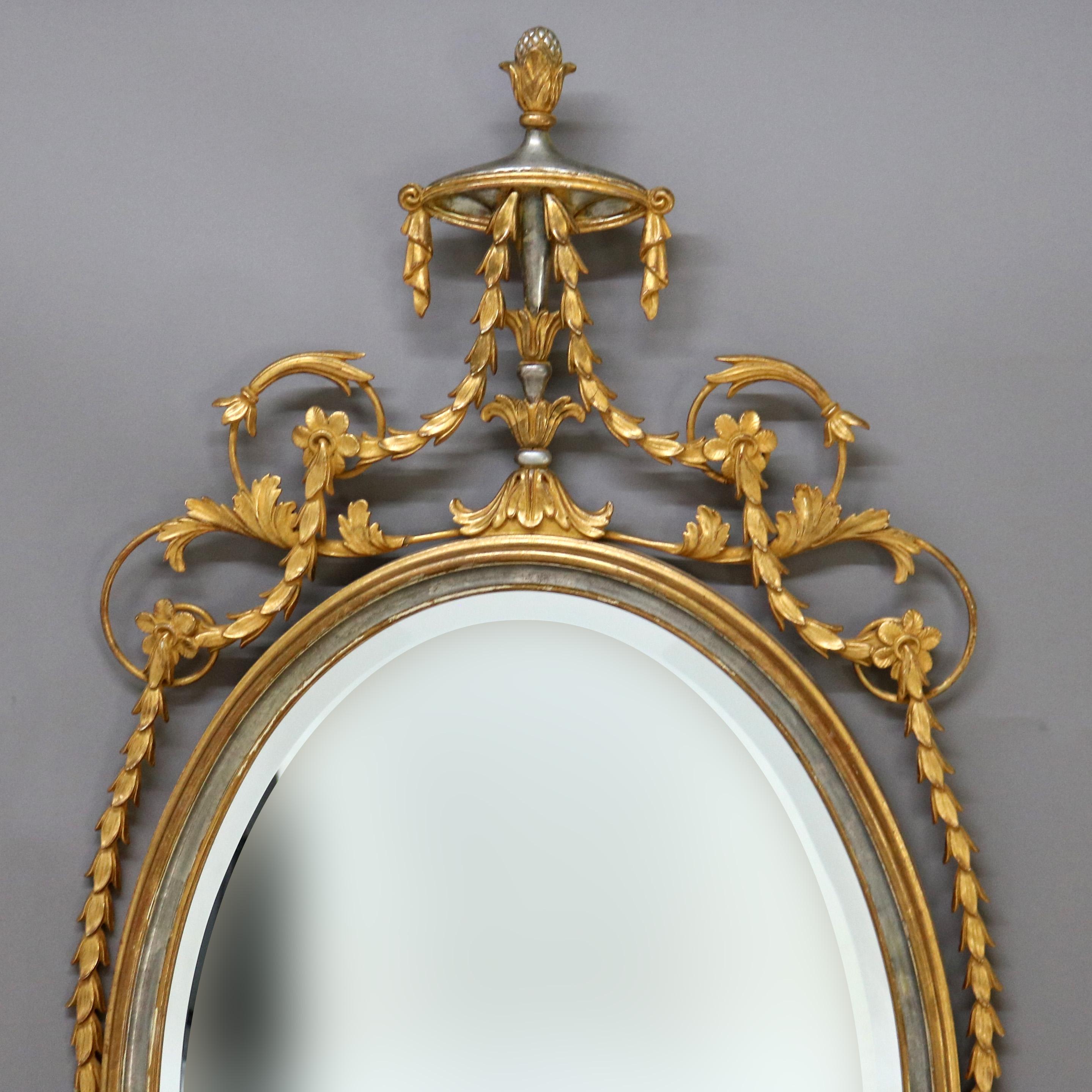 ***Reduced In-House Delivery Rates - Click on “Ask Seller” to Request a Quote***
Antique Oversized French Gilt Wood Oval Wall Mirror With Silver Embellishments and Urn Form Finial C1930
Measures - 52 1/2 x 28 w x 2 d
