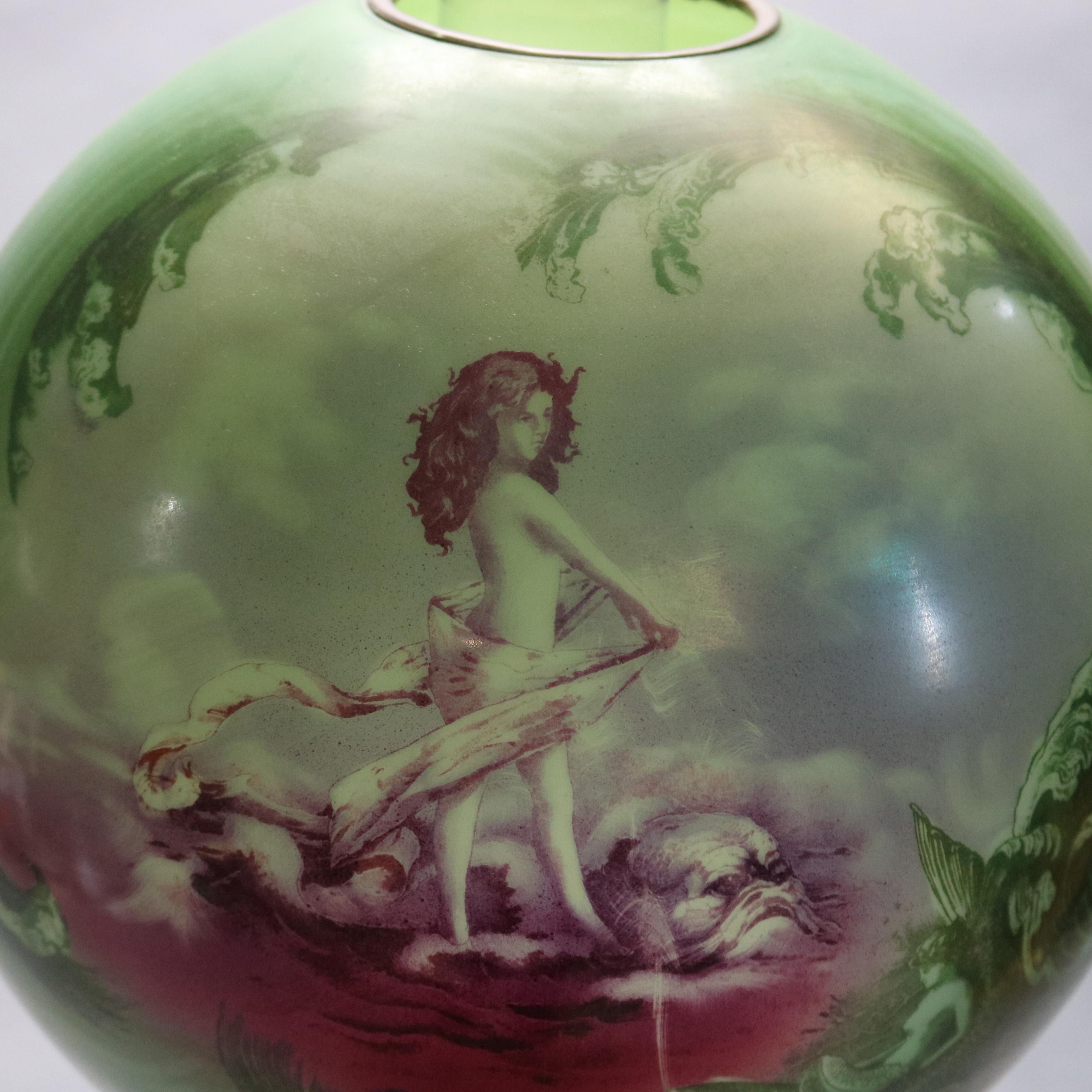 An antique large gone with the wind lamp offers hand painted glass shade and font with seascape scene having mermaid, lighted upper and lower, electrified, c1890

Measures: 28.5