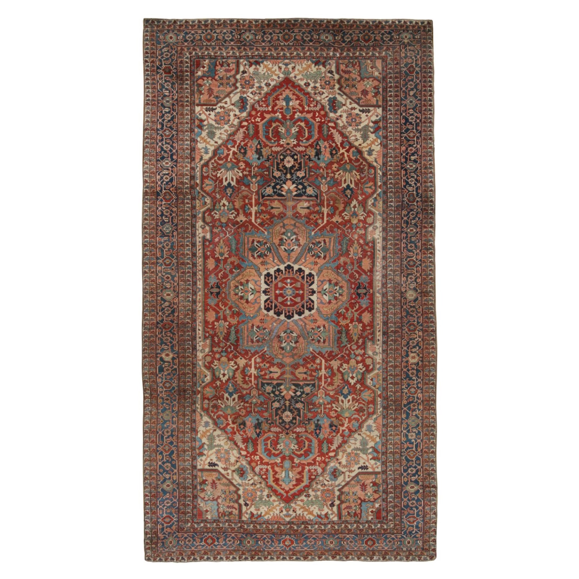Tapis persan Heriz ancien surdimensionné rouge avec médaillon en vente