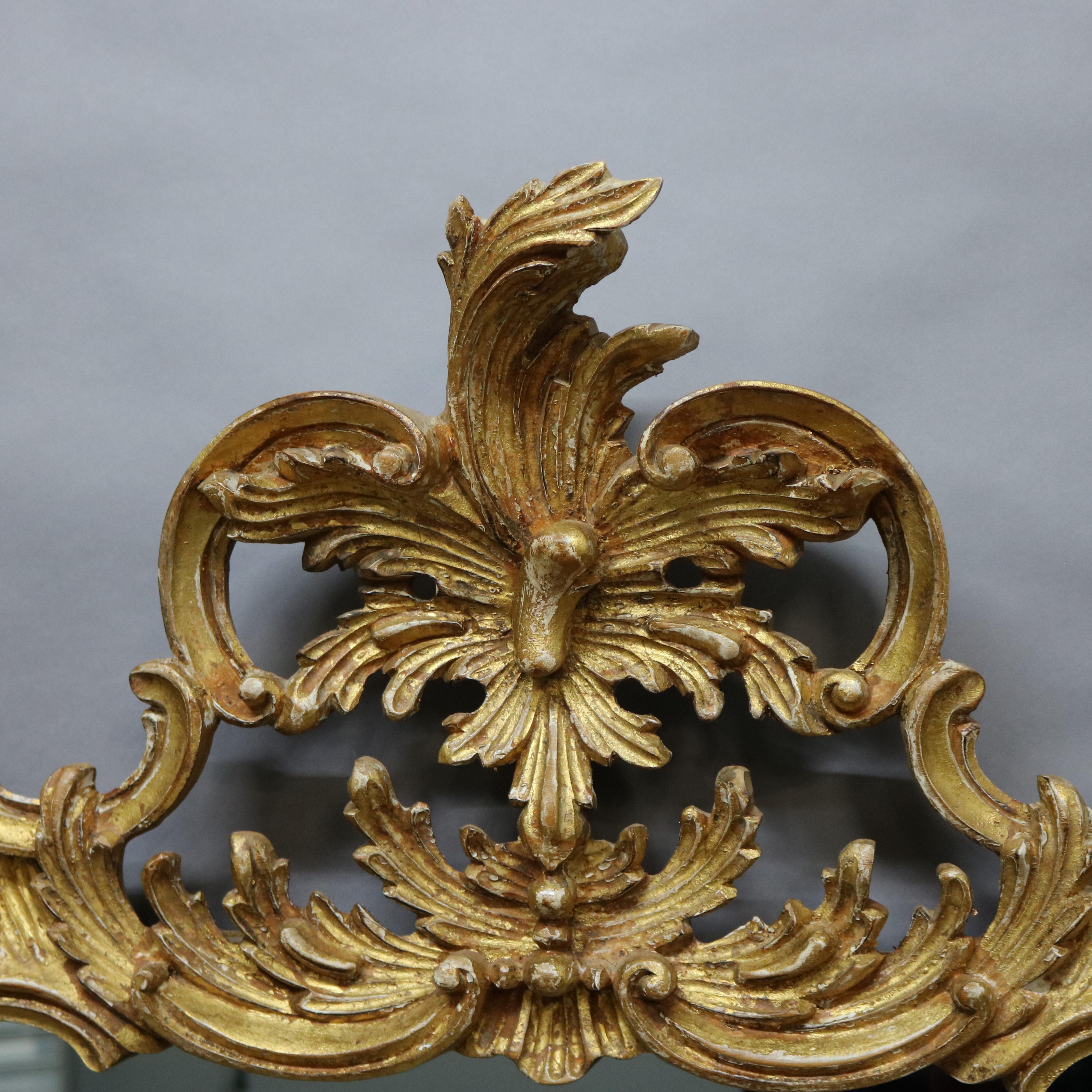 An antique and large Italian Rococo Revival over mantel wall mirror by LaBarge offers foliate and scroll form giltwood frame giltwood wall mirror, 20th century
label on back
Measures: 57