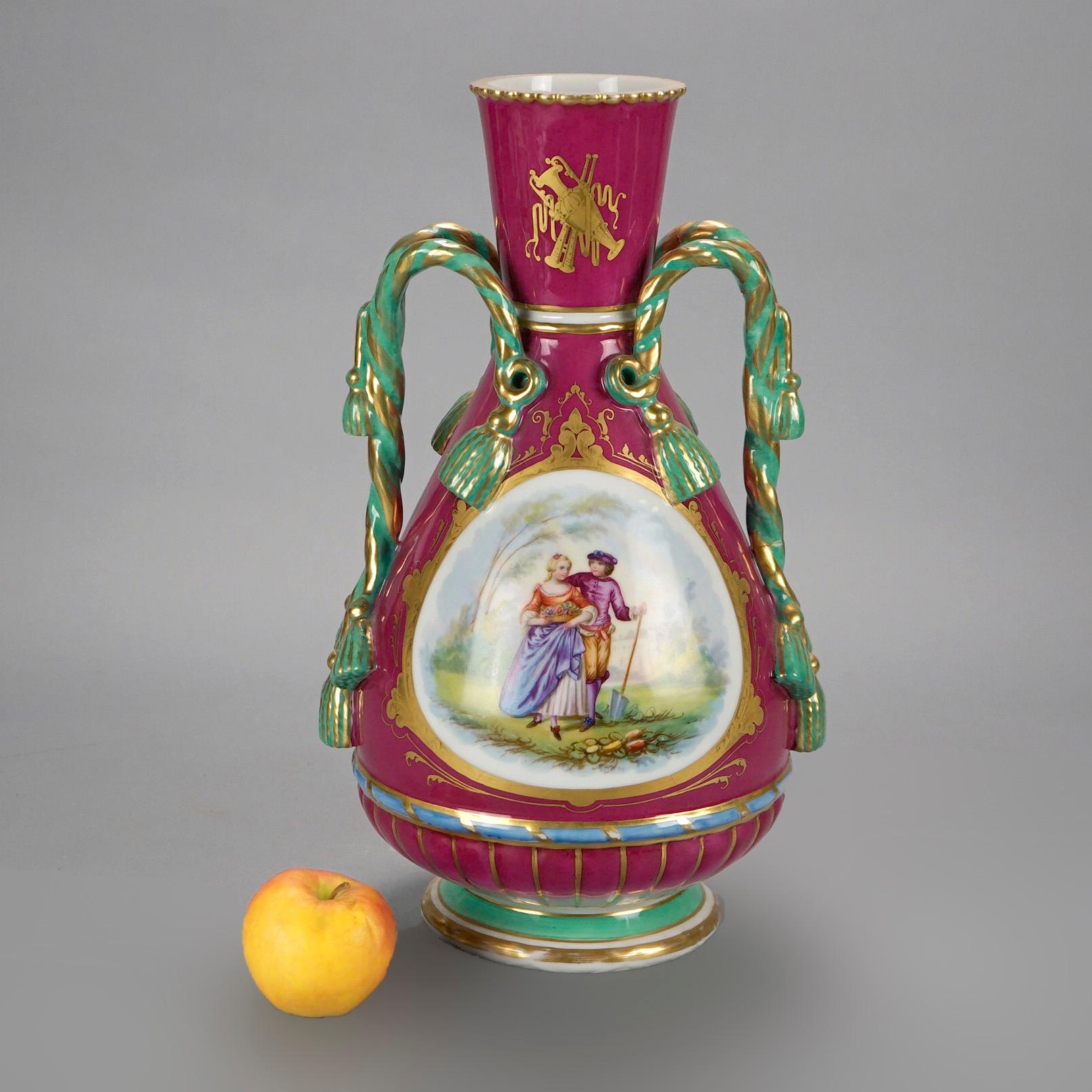 An antique and large French Old Paris vase offers porcelain construction with hand painted genre reserve depicting courting couple in countryside setting, gilt highlights throughout and flanking tassel form handles, 19th century

Measures- 15'' H x