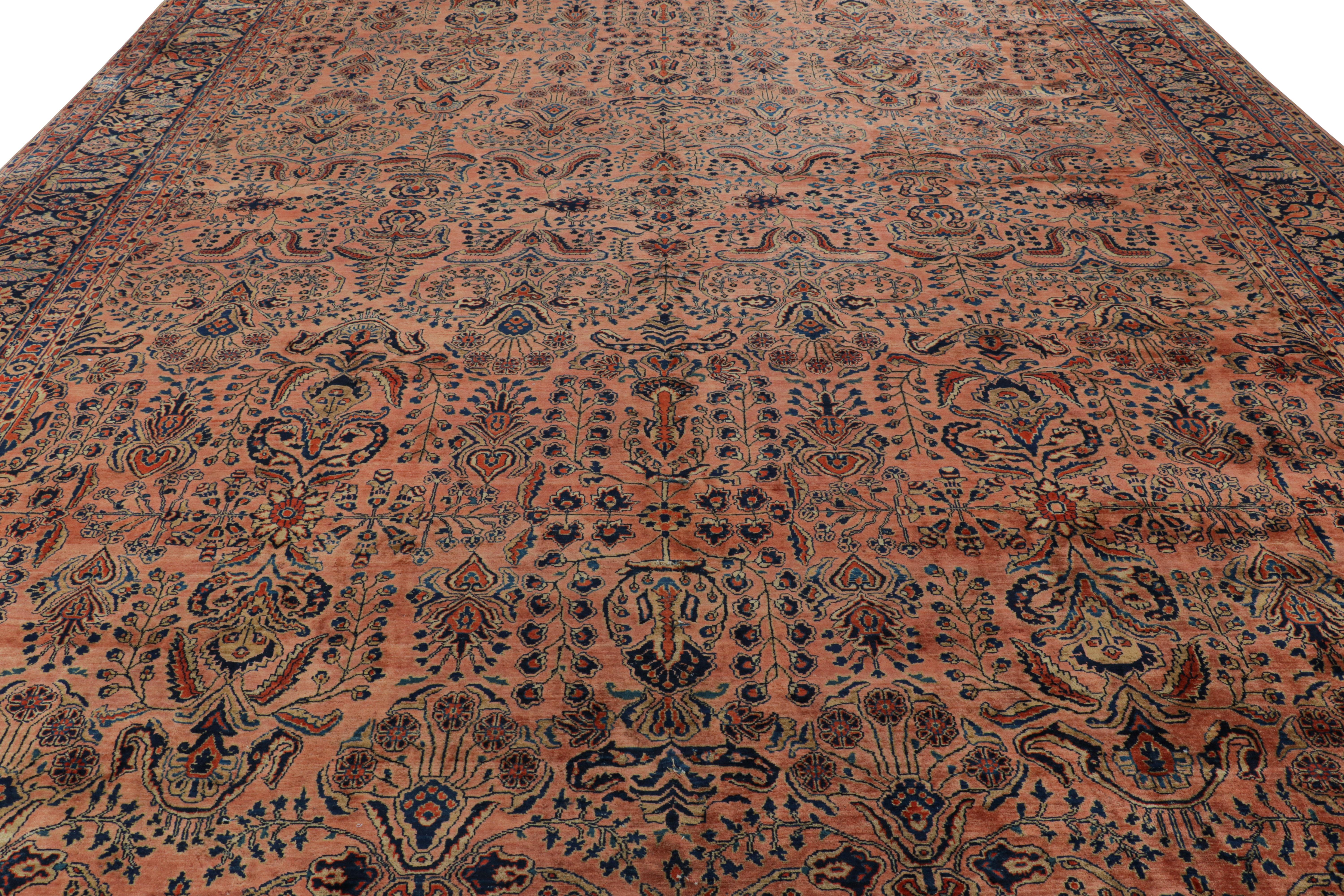 Hand-knotted in wool, this 12x19 antique Persian Sarouk rug originating circa 1920-1930, with intricate floral patterns, is a masterpiece from one of the most sought-after weaving traditions in Persian city rugs. 

On the Design: 

This piece enjoys