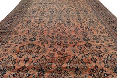 Antique Oversized Sarouk Persian Rug in Pink with Floral Patterns
