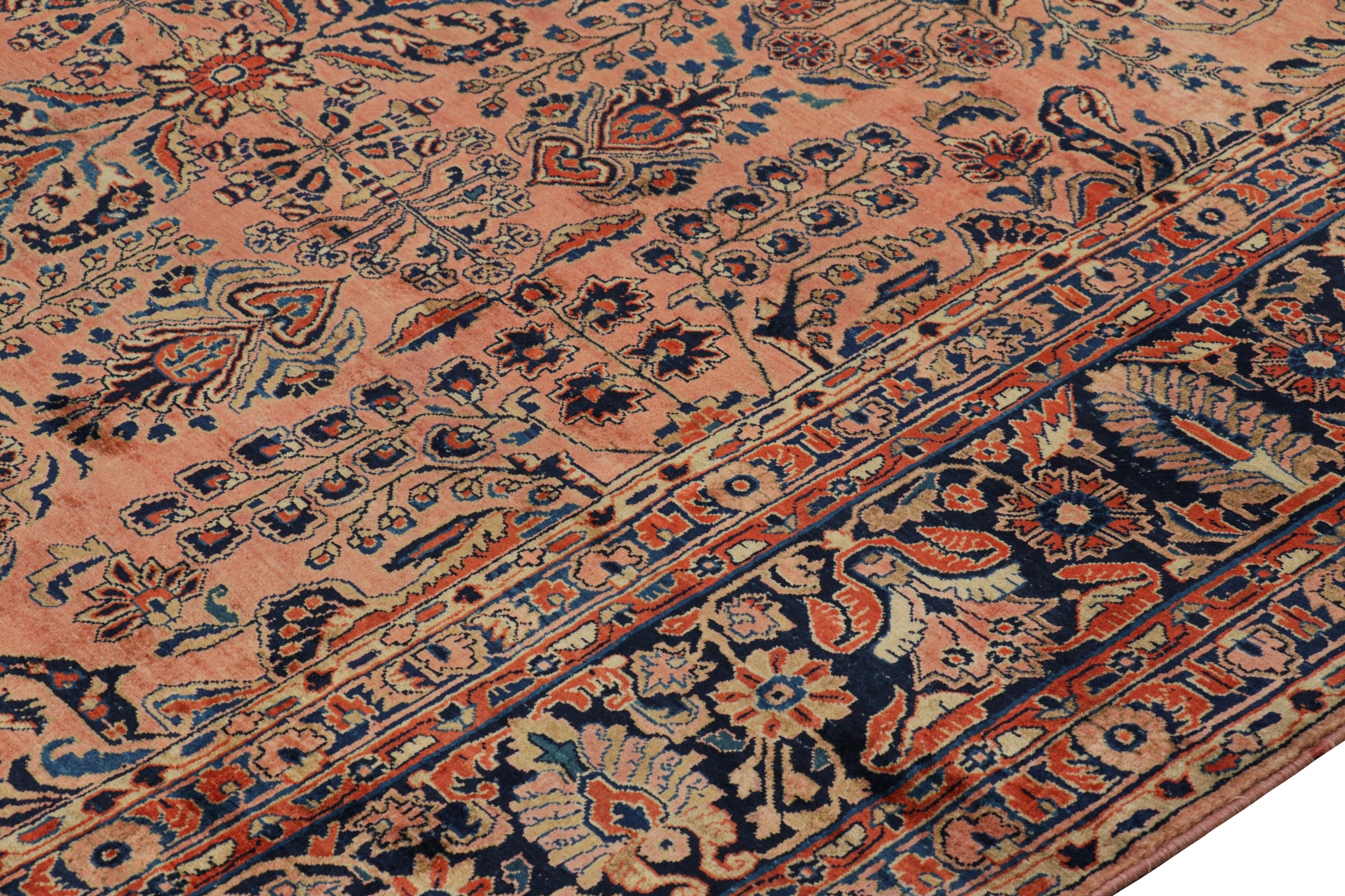 Wool Antique Oversized Sarouk Persian Rug in Pink with Floral Patterns For Sale
