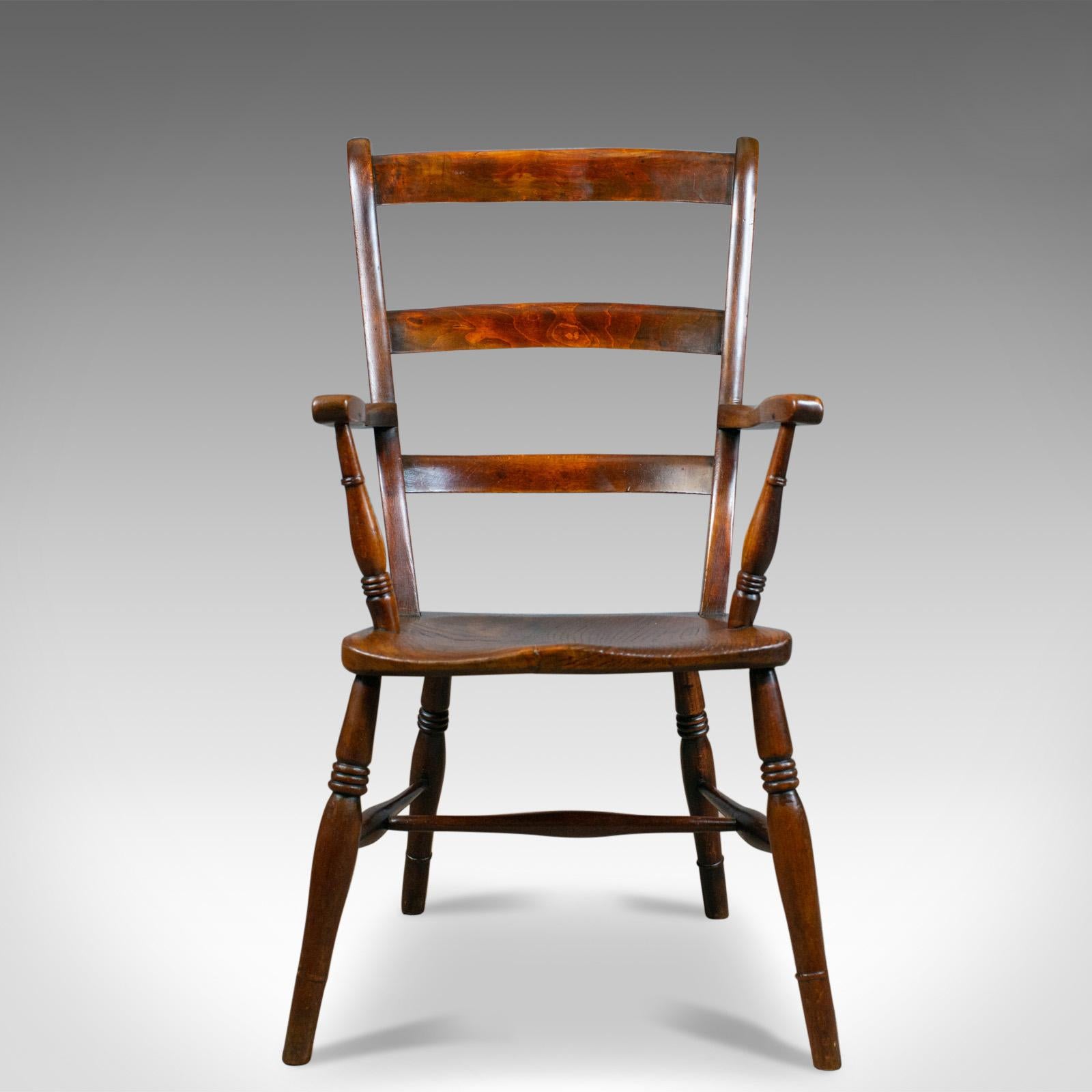 This is an antique Oxford elbow chair. A Victorian, country kitchen, Windsor, lath back, armchair in elm and beech, dating to the mid-19th century, circa 1850.

Super chair in Fine order throughout
Classic, flared lath back, raked for