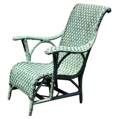 Antique Paddle Arm Wicker Lounge Chair