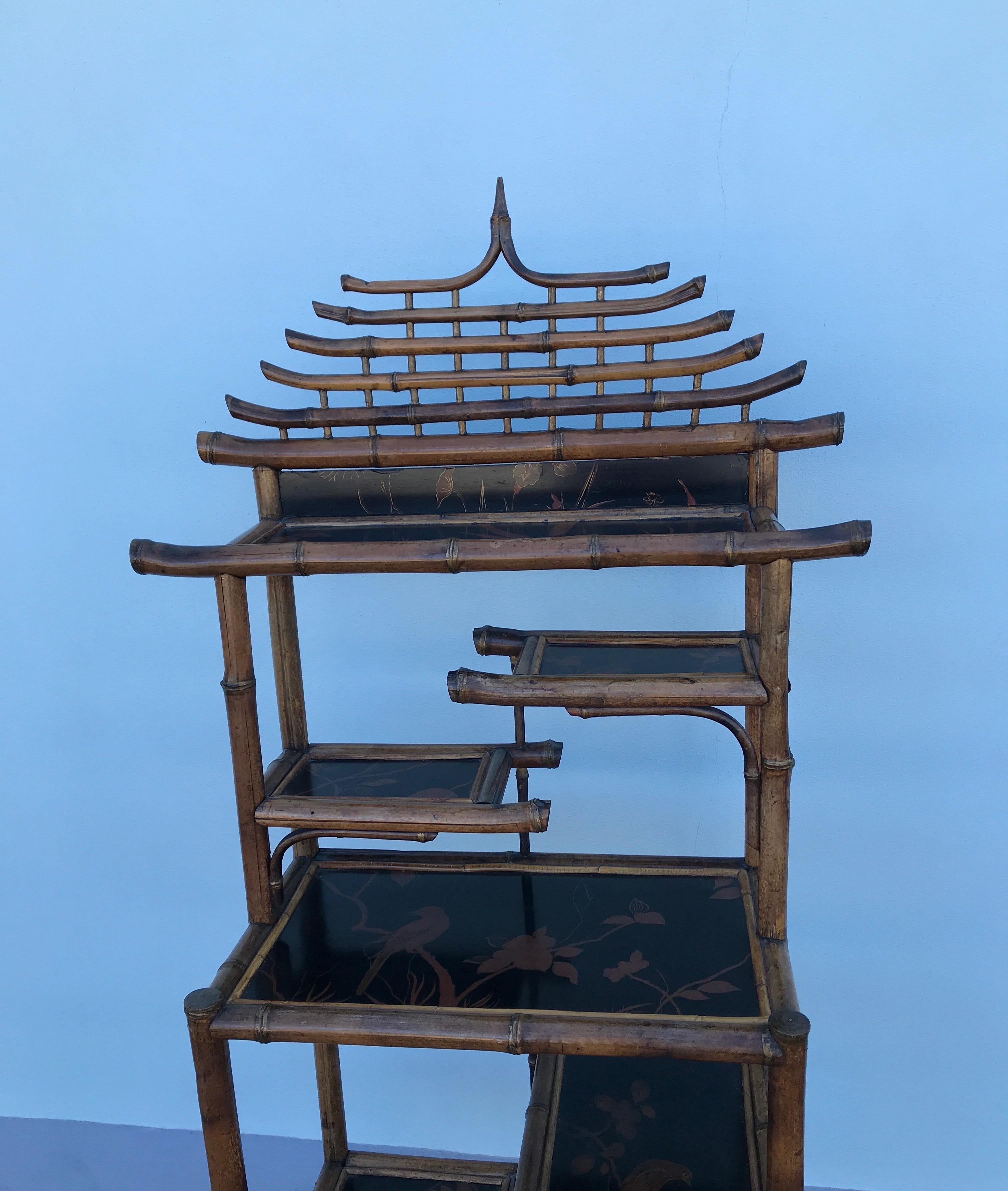 Antique pagoda style bamboo etagere with six shelves.