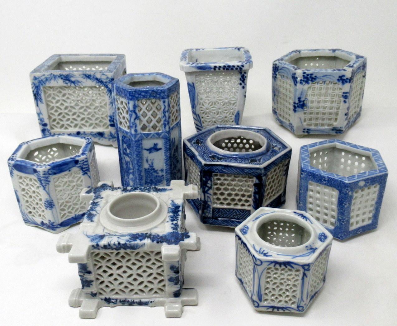 Stylish Assembled Set of eight Hand Painted Chinese Export Reticulated Pierced Blue and White Porcelain Vases of hexagonal and square outline, sometimes referred to as cricket pots or cages, together with a very unusual Chinese lidded inkwell with