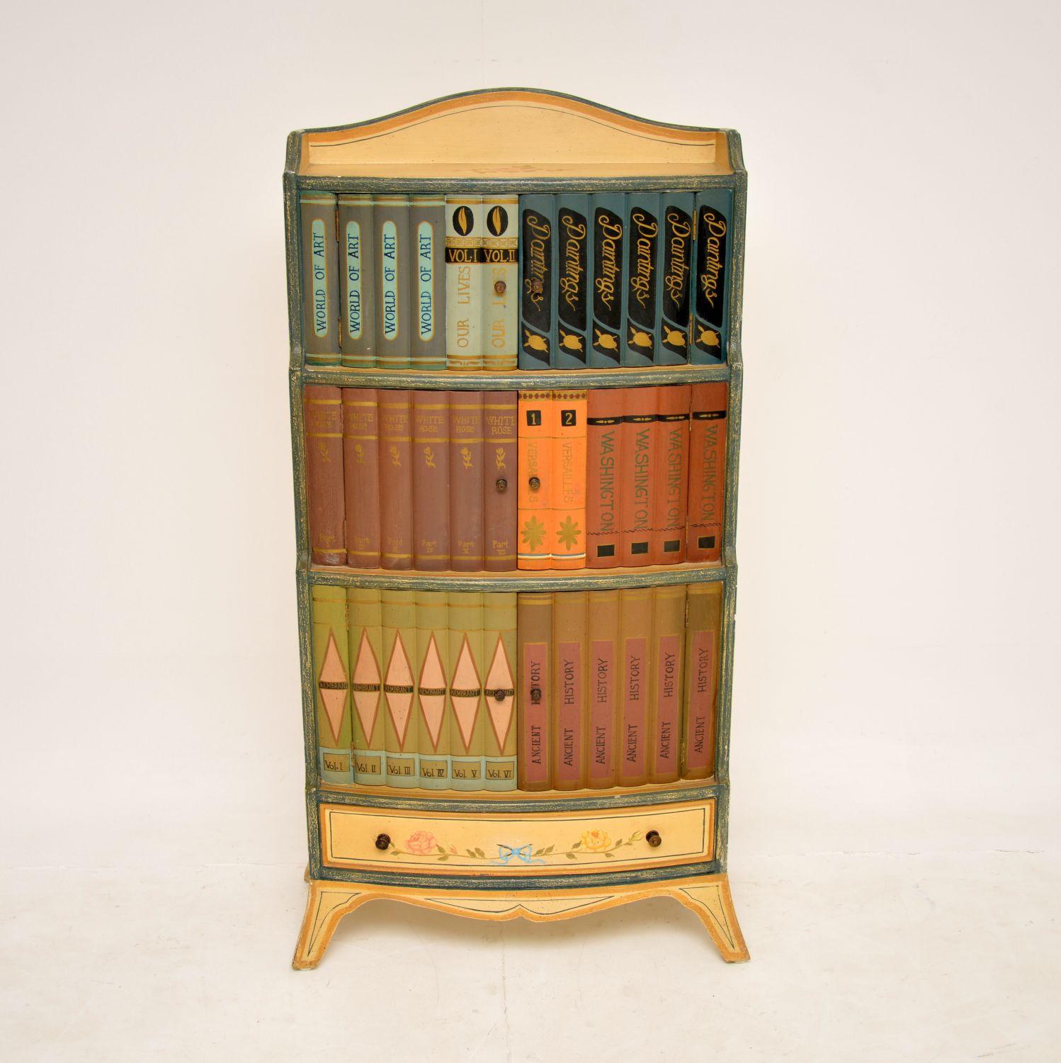 A fantastic antique painted bookcase cabinet of superb quality. This was made by the high end furniture manufacturer Maitland-Smith, it dates from around the 1960’s.

This is extremely well made and solidly built, with beautiful hand painted