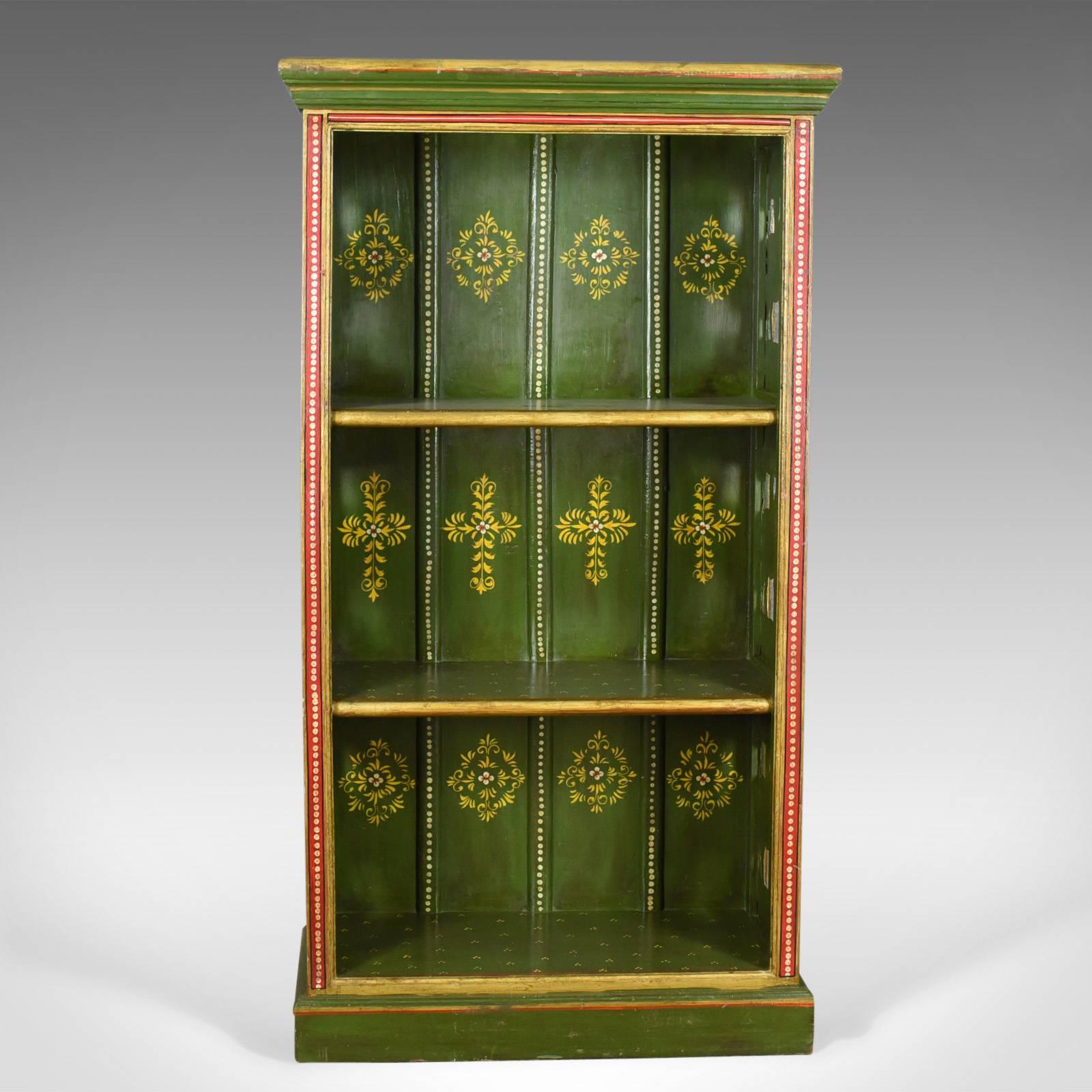 This is an antique painted bookcase, a European, possibly Scandinavian, Provincial book shelf with an equine theme dating to circa 1900.

Substantially crafted in hardwood
Traditionally painted in red, green and gold
Decorated with stylized