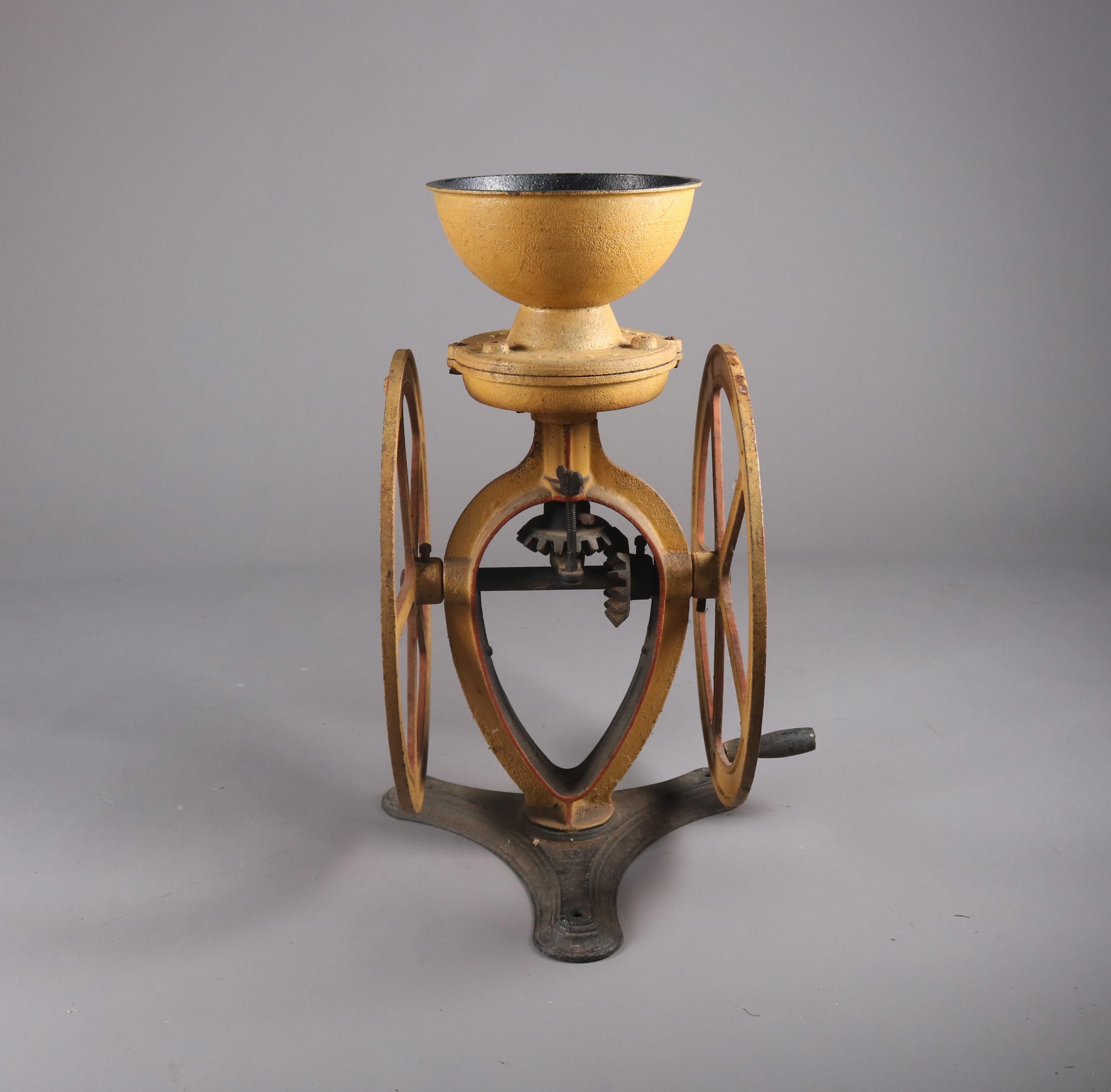 Antique cast iron countertop coffee grinder by Lane Brothers features old repaint, yellow with red, 19th century

Measures: 29.5