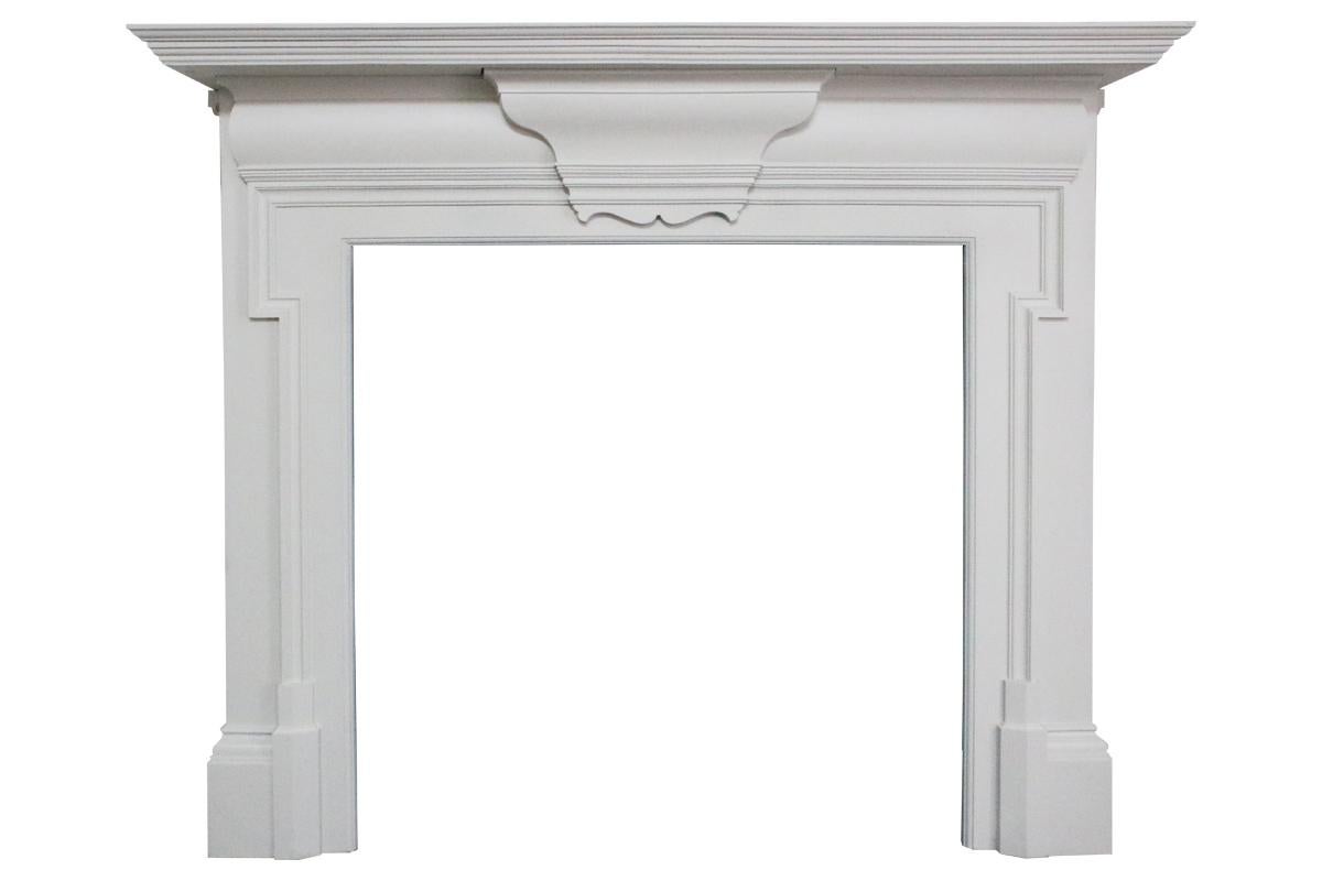 Antique Edwardian cast iron fire surround in the Georgian revival style, the jambs benefiting from a dog leg moulding and a deep stepped mantel (fireplace) shelf, circa 1900. Fully restored and finished with a sprayed on high quality universal
