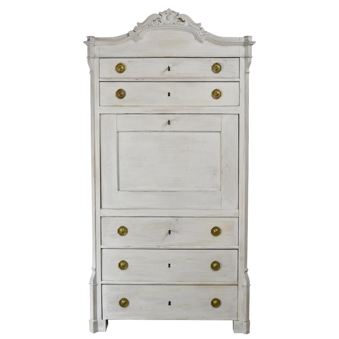 A very lovely Louis Philippe fall-front secretary in pine with a light Gustavian-grey/white painted finish, and original French-polished birch wood interior. Features a carved bonnet top with two storage drawers above the fall-front and three