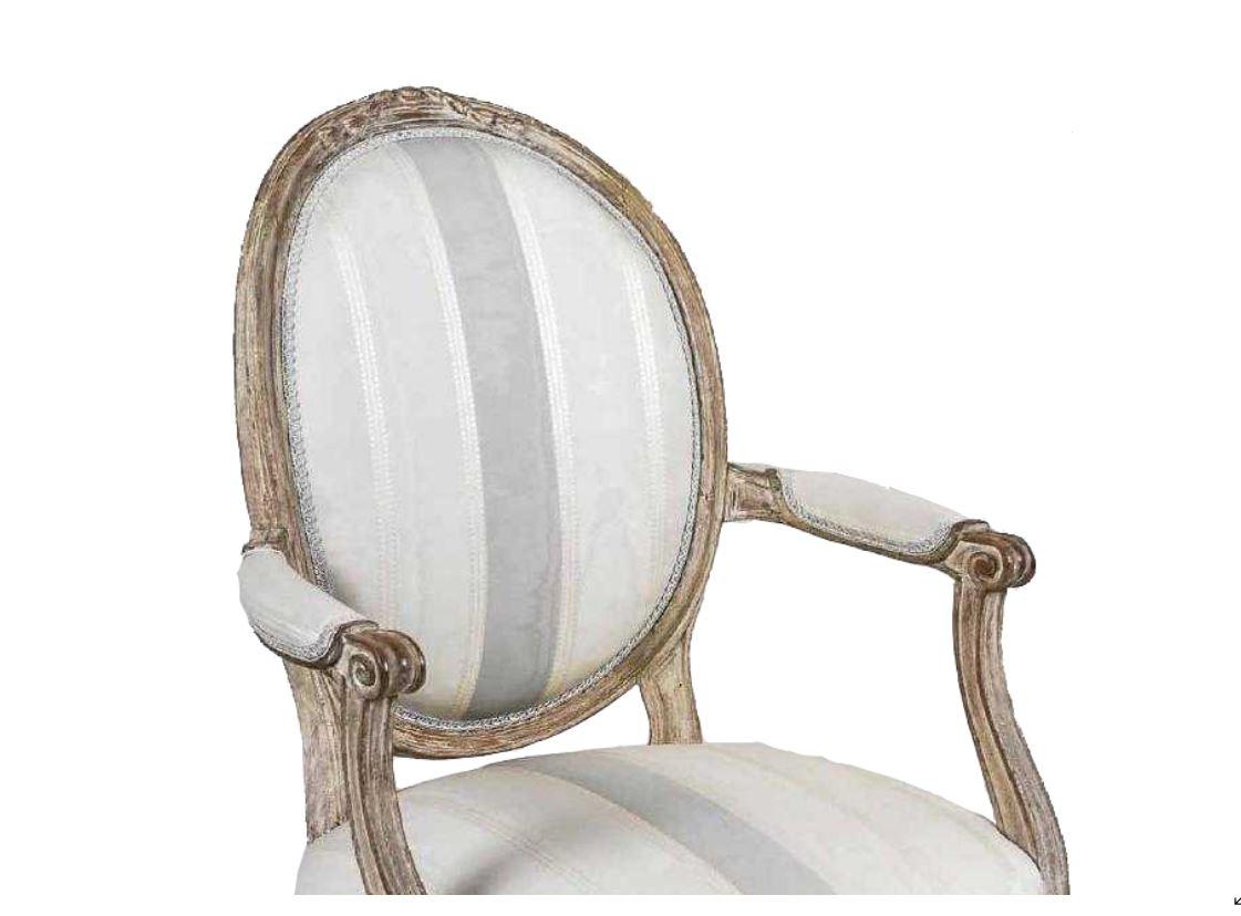 Antique painted Louis XVI style armchair with tapered fluted legs, bow front seat, oval upholstered padded back, striped fabric.