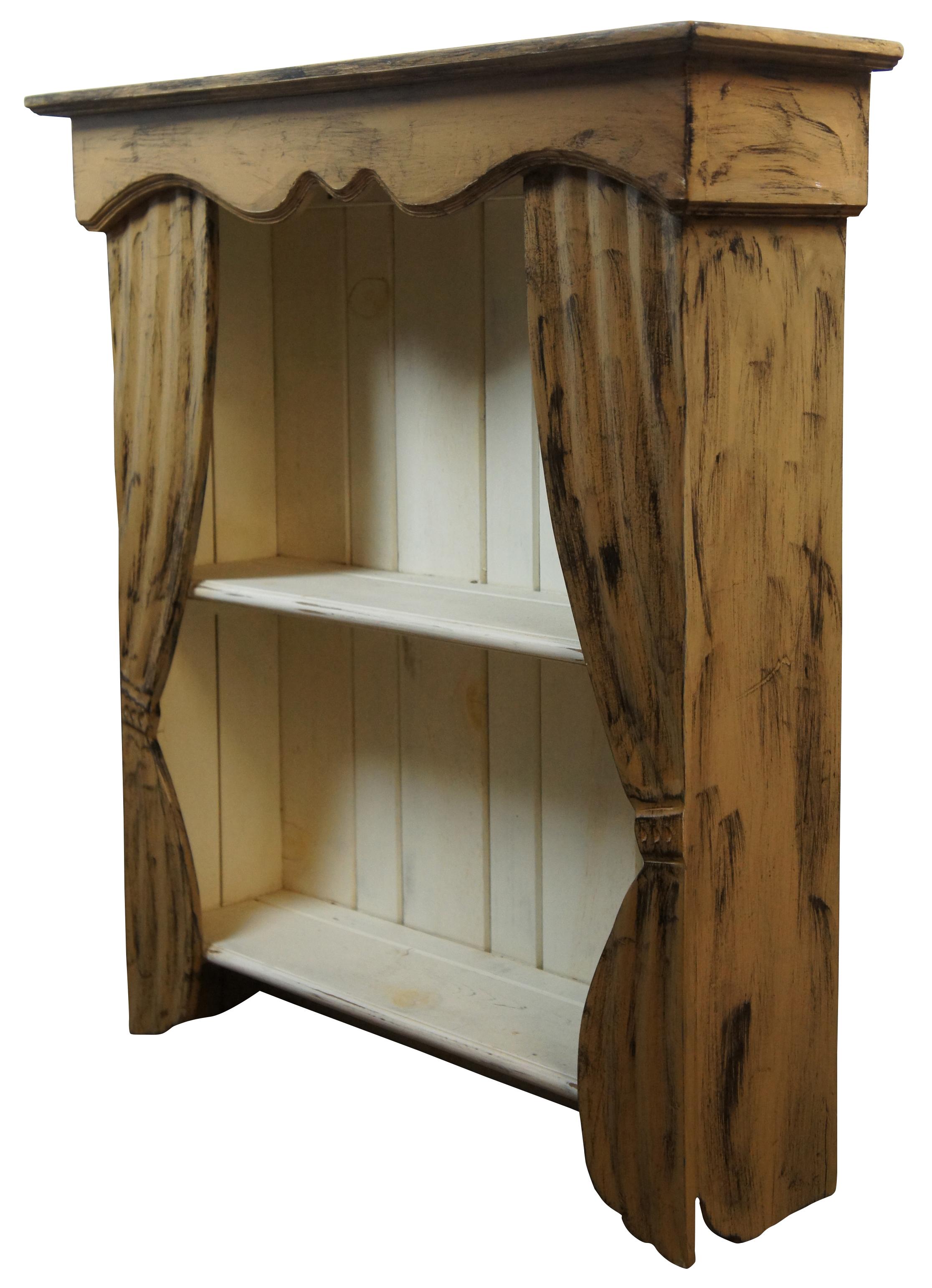 Large antique wall hanging shelf with two tiers, framed like a stage proscenium or window with carved curtains. Made from Pine. Measure: 35